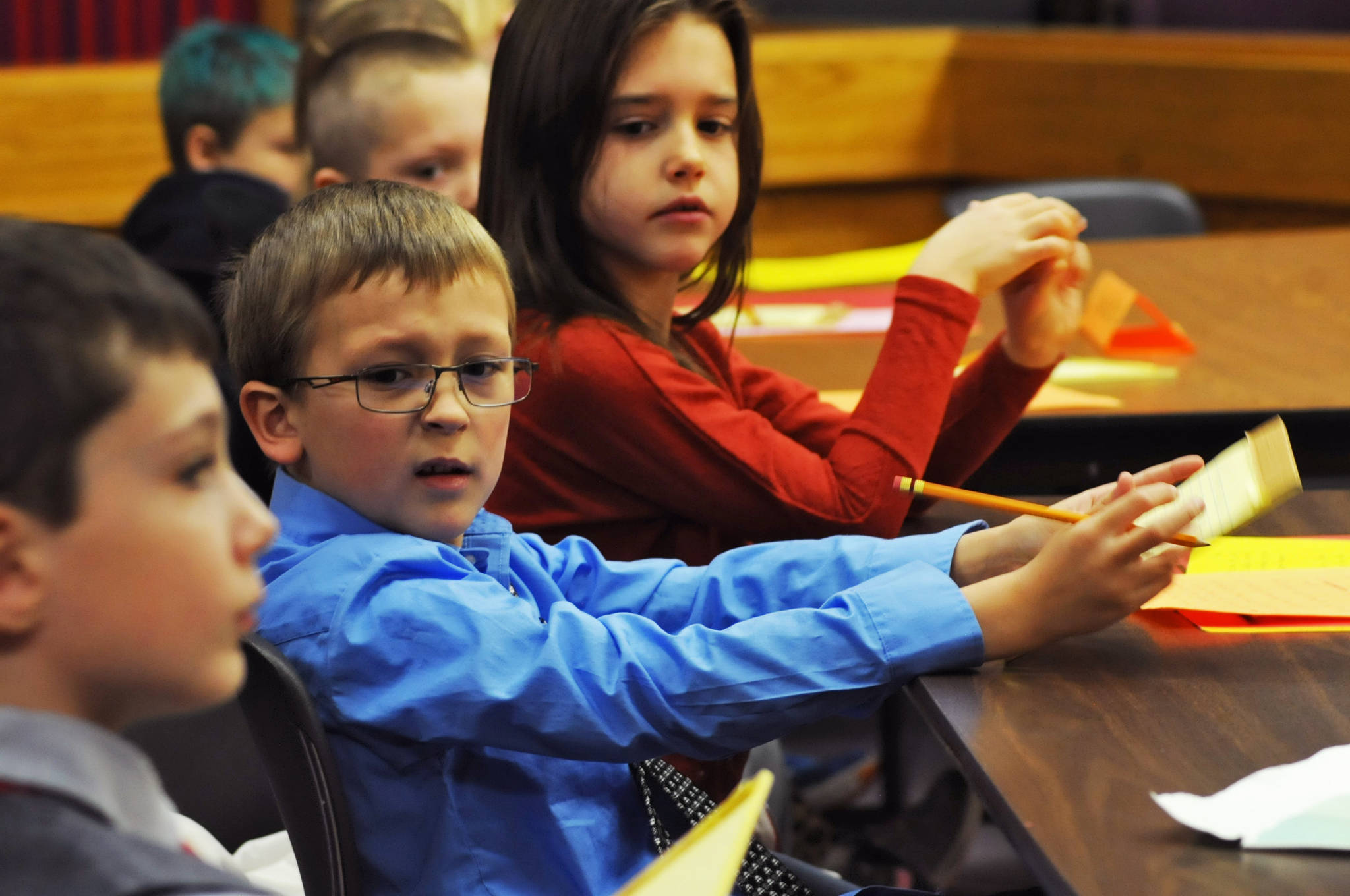 James Jensen, a second-grader at Kalifornsky Beach Elementary School, makes a face as one of his co-attorneys in the defense of “Arthur T. Grinch” asks a question during the class’s mock trial based on Dr. Seuss’s classic “How the Grinch Stole Christmas” on Thursday, Nov. 9, 2017 in Kenai, Alaska. The class has been studying civics and learning about the court process and put on a mock sentencing hearing, complete with witnesses and a jury composed of students’ parents and K-Beach Elementary Principal Nate Crabtree. (Photo by Elizabeth Earl/Peninsula Clarion)