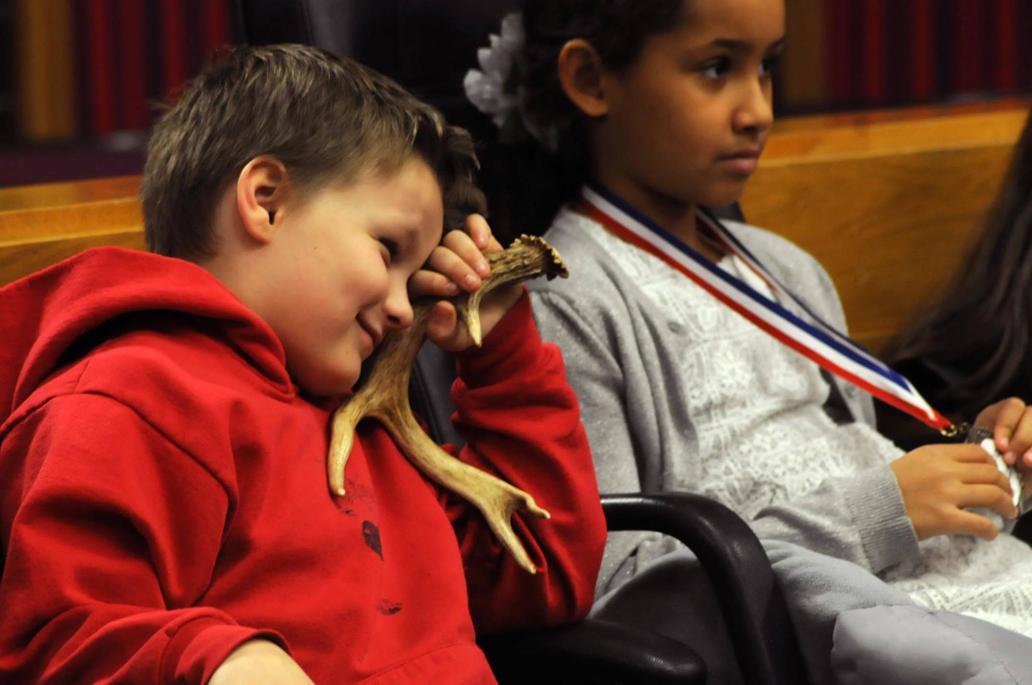 James Hartness, a second grader at Kalifornsky Beach Elementary School, playing the character of “Max,” listens during a witness’s testimony during the class’s mock trial of “Arthur T. Grinch,” based on Dr. Seuss’s classic “How the Grinch Stole Christmas” on Thursday, Nov. 9, 2017 in Kenai, Alaska. The class has been studying civics and learning about the court process and put on a mock sentencing hearing, complete with witnesses and a jury composed of students’ parents and K-Beach Elementary Principal Nate Crabtree. (Photo by Elizabeth Earl/Peninsula Clarion)