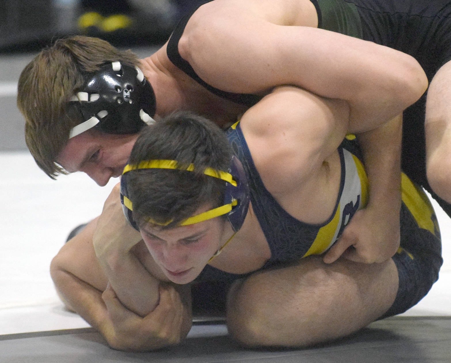 Colony’s Caleb Hopkins controls Homer’s Tristen Cook at 182 pounds en route to a 2-1 decision Saturday, Nov. 11, 2017, in the championship dual of the Peninsula Duals at Nikiski High School. (Photo by Jeff Helminiak/Peninsula Clarion)