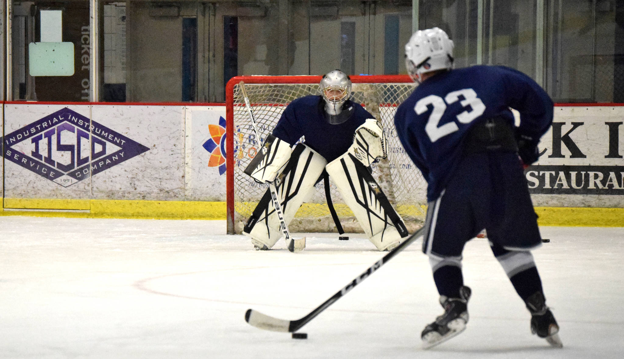 A goalie from Soldotna High School’s Soldotna Stars hockey team prepares to block a teammate’s shot during a practice on Monday, Nov. 13 at the Soldotna Regional Sports Complex in Soldotna. (Ben Boettger/Peninsula Clarion)