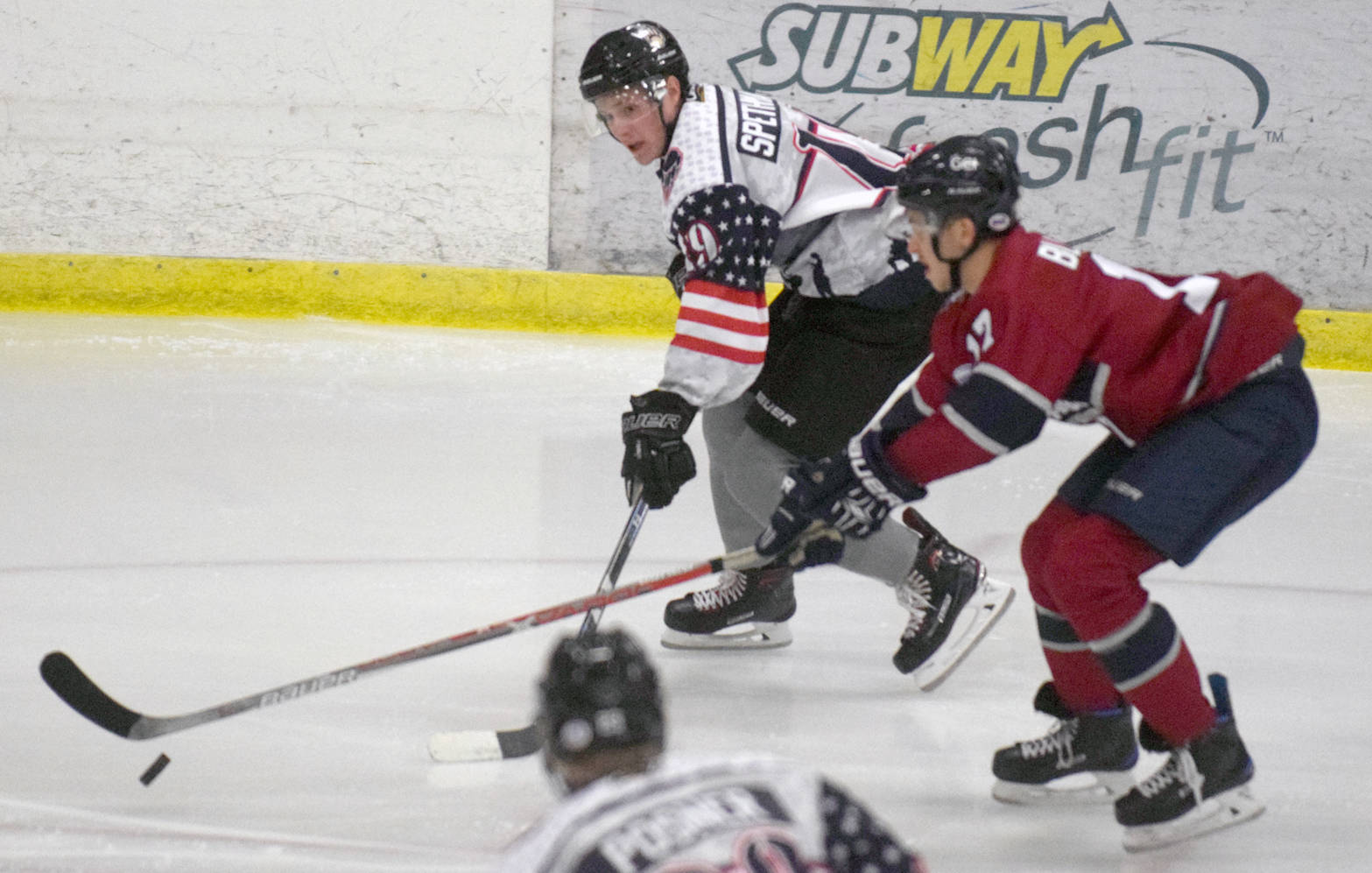 Kenai River Brown Bears forward Michael Spethmann challenges for the puck Nov. 3, 2017, against the Fairbanks Ice Dogs at the Soldotna Regional Sports Complex. (Photo by Jeff Helminiak/Peninsula Clarion)