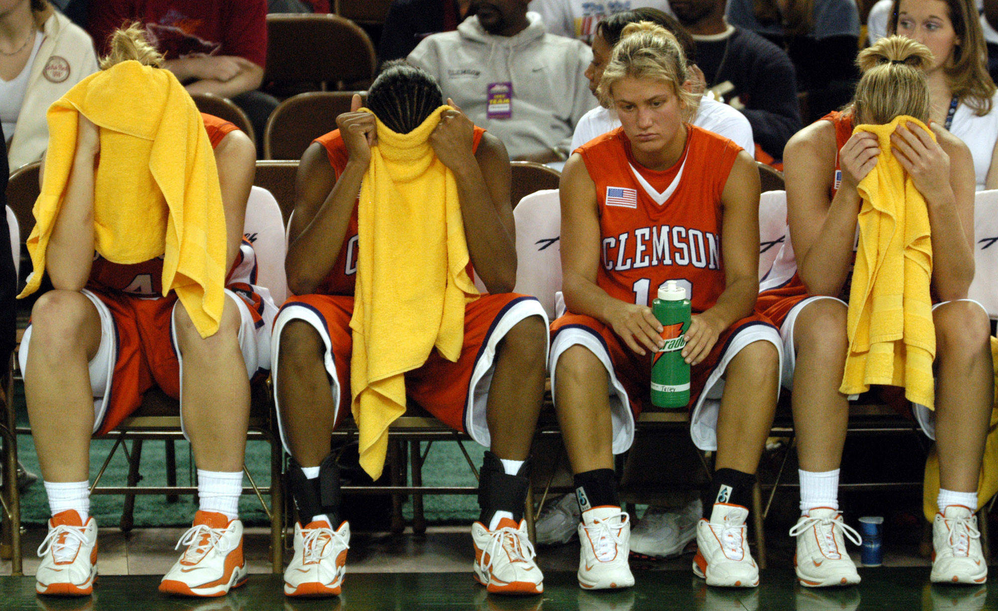 FILE - In this Nov. 26, 2003, file photo, from left, Clemson’s Maggie Slosser, Lakeia Stokes, Julie Talley and Julie Aderhold sit on the bench after Clemson’s 61-58 loss to Alasaka-Anchorage in the championship game of the Great Alaska Shootout on in Anchorage, Alaska. Shootout fans over the years witnessed the best of college basketball, with Duke, North Carolina, Kentucky, Michigan State and UCLA winning titles, but the end is near. The 40th Shootout will be the last, a victim of changed rules and competition.(AP Photo/Michael Dinneen, file