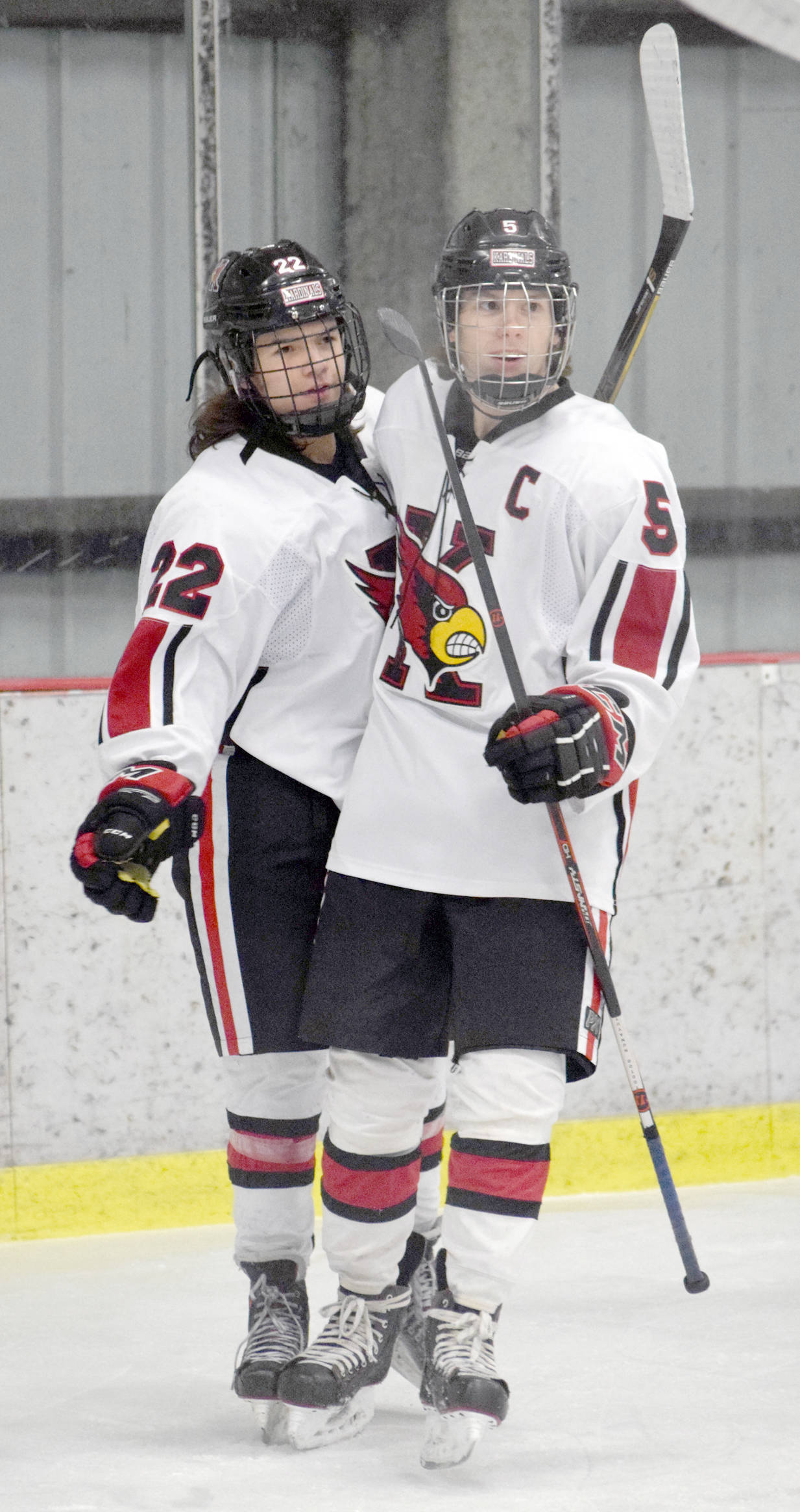 Kenai Central forward Levi Mese (5) celebrates the first of his five goals against Soldotna with Matt Hagel on Tuesday, Nov. 21, 2017, at the Kenai Multi-Purpose Facility. (Photo by Jeff Helminiak/Peninsula Clarion)