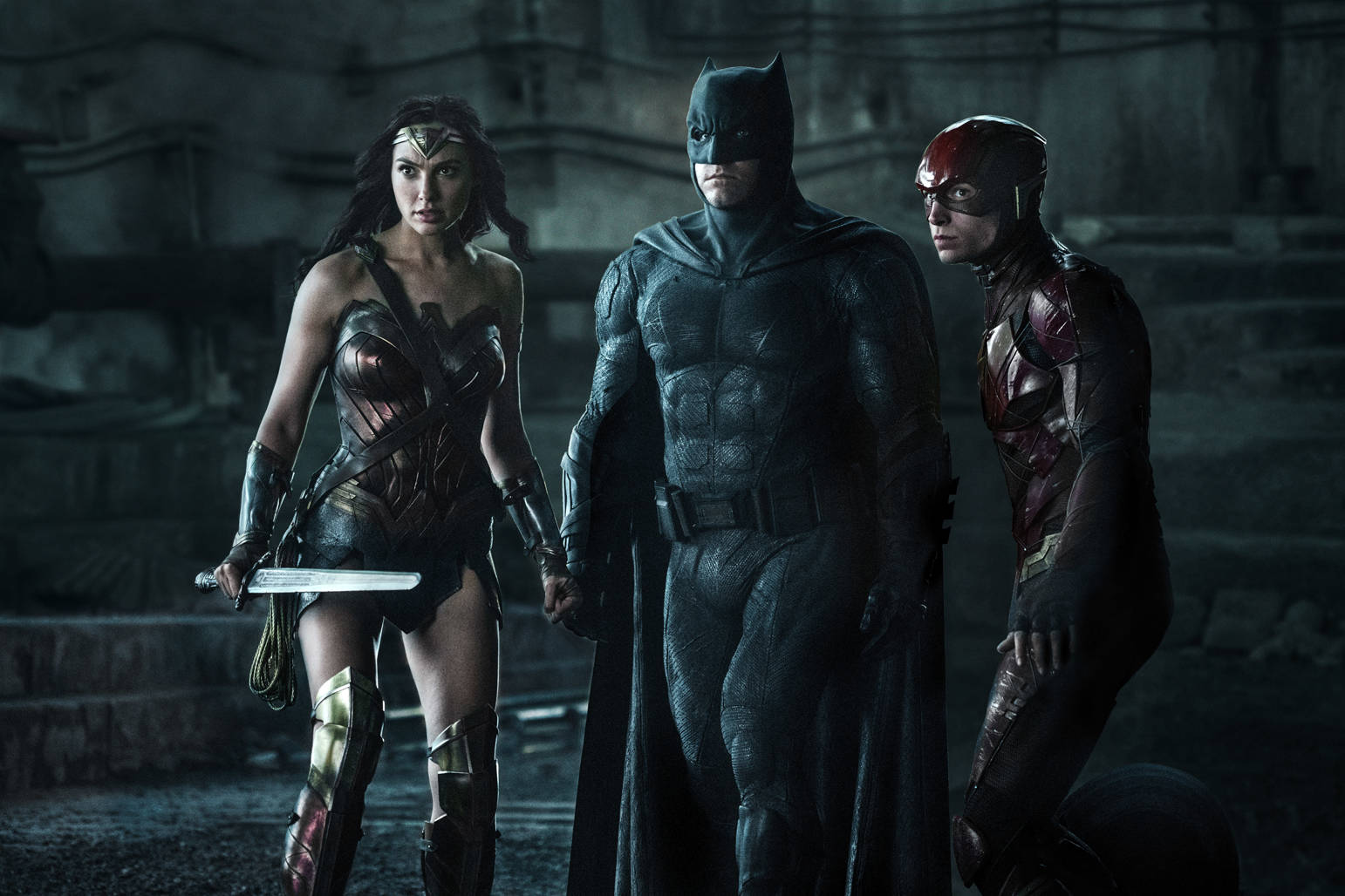 This image released by Warner Bros. Pictures shows Gal Gadot, from left, Ben Affleck and Ezra Miller in a scene from “Justice League.” (Clay Enos/Warner Bros. Entertainment Inc. via AP)