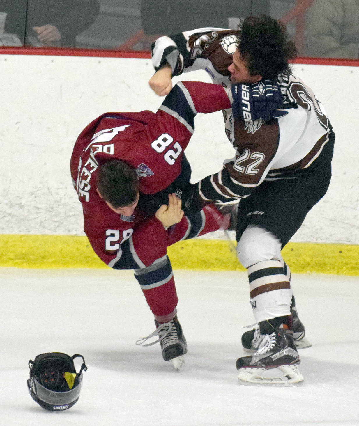 Kenai River Brown Bears defenseman Connor Scahill gets the better of Fairbanks Ice Dogs forward Tyler Deweese in a fight Friday, Nov. 24, 2017, at the Soldotna Regional Sports Complex. (Photo by Jeff Helminiak/Peninsula Clarion)
