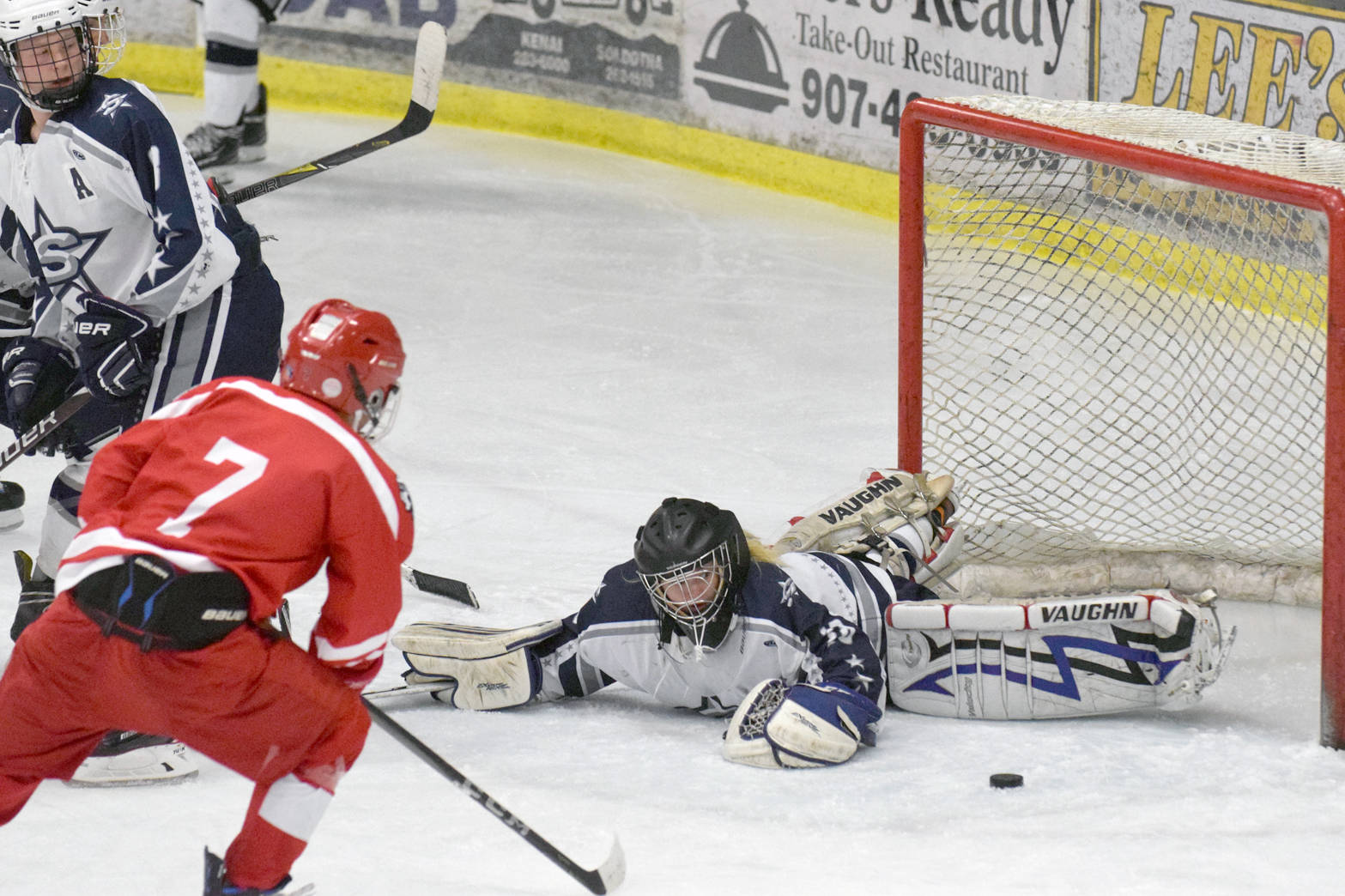 Soldotna goalie McKenzie Powell recovers in time to keep Wasilla from scoring Friday, Dec. 1, 2017, at the Soldotna Regional Sports Complex. (Photo by Jeff Helminiak/Peninsula Clarion)