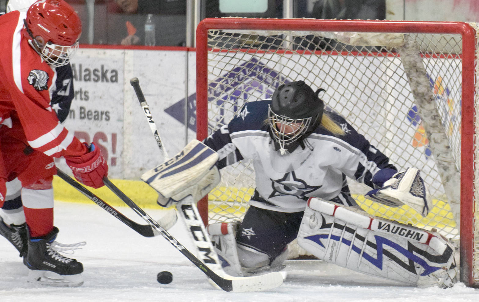 Soldotna’s McKenzie Powell makes a save Friday, Dec. 1, 2017, at the Soldotna Regional Sports Complex. (Photo by Jeff Helminiak/Peninsula Clarion)