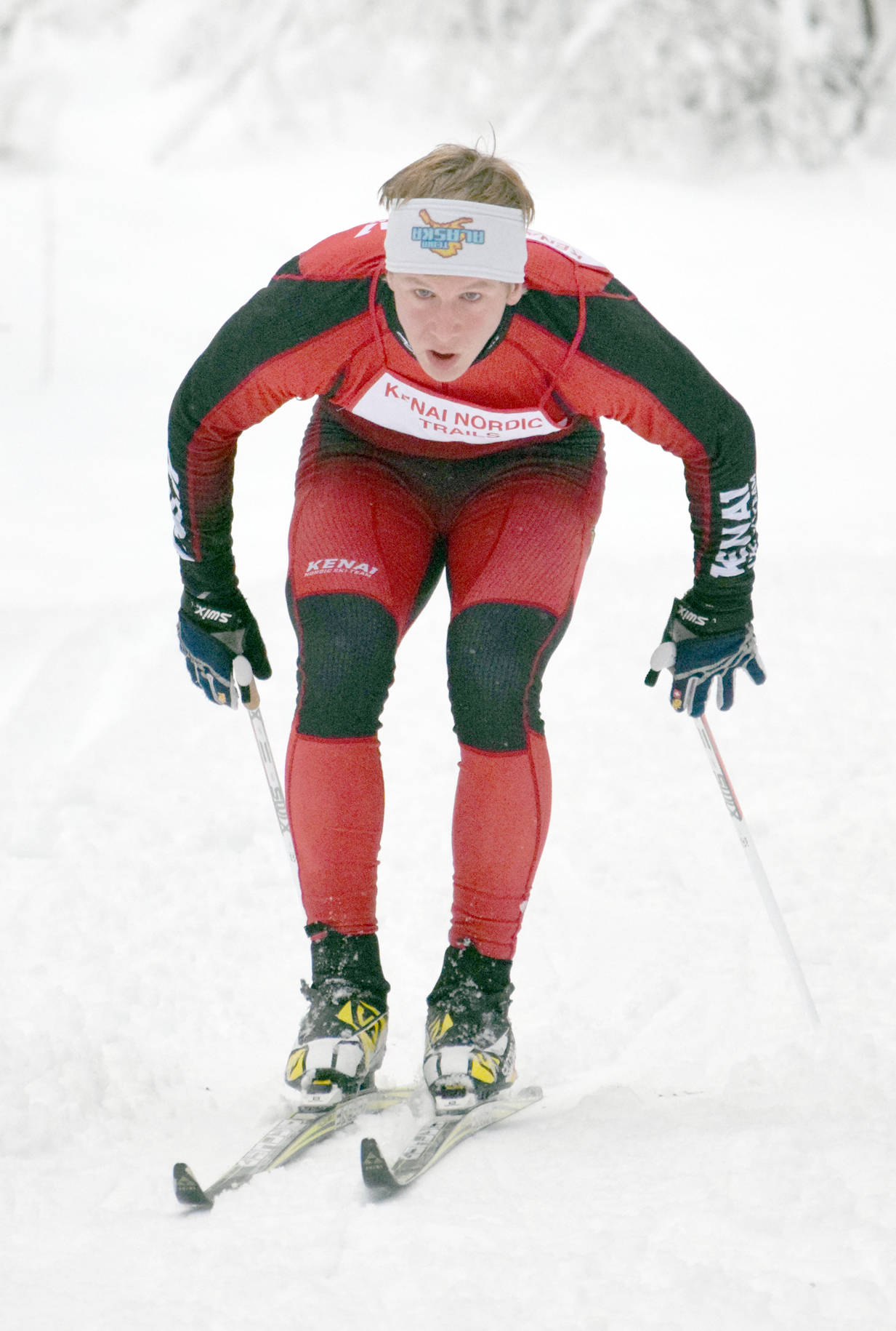 Kenai Central’s Karl Danielson double-poles up a hill on his way to victory Saturday, Dec. 2, 2017, at the Tsalteshi Classic Invitational at Tsalteshi Trails. (Photo by Jeff Helminiak/Peninsula Clarion)