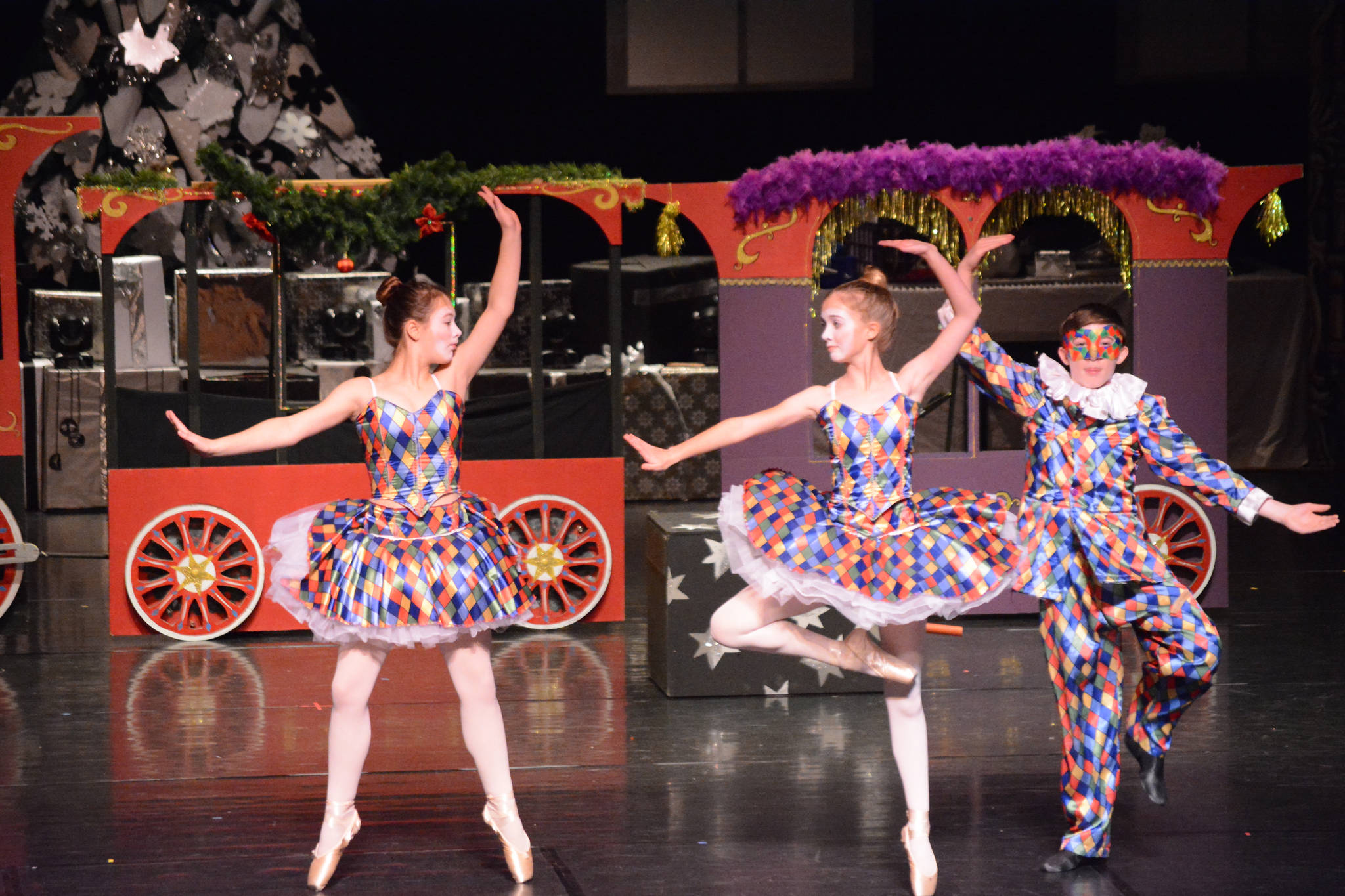 Serena Funkhauser, Ava Halstead and Lance Seneff as the harlequin toys rhearse a scene at the Mariner Theatre Nov. 24 in Homer for the Nutcracker Ballet. (Photo by Michael Armstrong, Homer News)