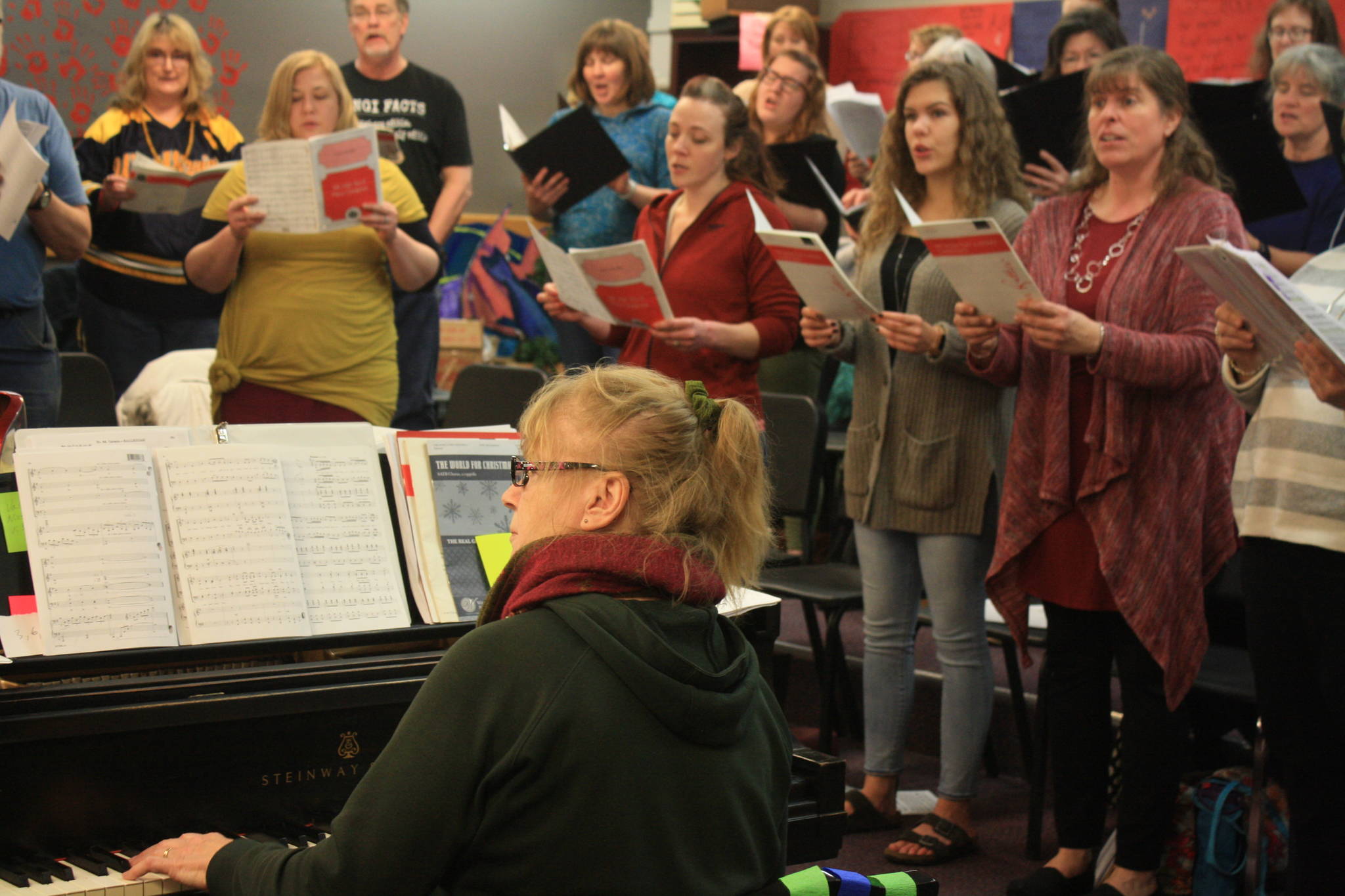 Accompanist Maria Allison plays during a rehearsal of the Kenai Peninsula Singers on Dec. 11. The Peninsula Singers and Redoubt Chamber Orchestra will perform together in the 2017 Evening of Christmas on Friday, Dec. 15. (Photo by Erin Thompson/Peninsula Clarion)
