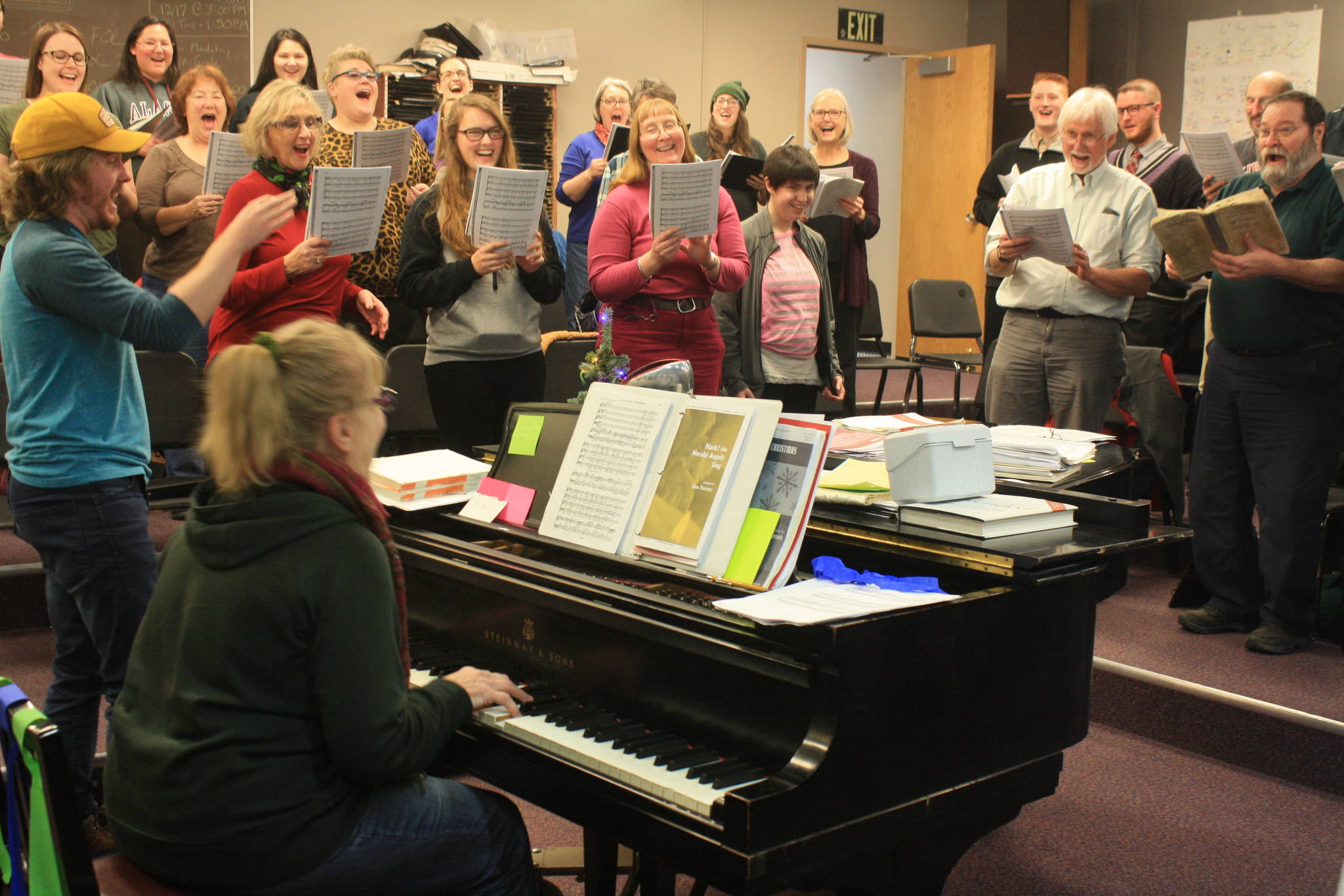 Members of the Kenai Peninsula Singers perform during a rehearsal on Dec. 11. The Peninsula Singers and Redoubt Chamber Orchestra will perform together in the 2017 Evening of Christmas on Friday, Dec. 15. (Photo by Erin Thompson/Peninsula Clarion)