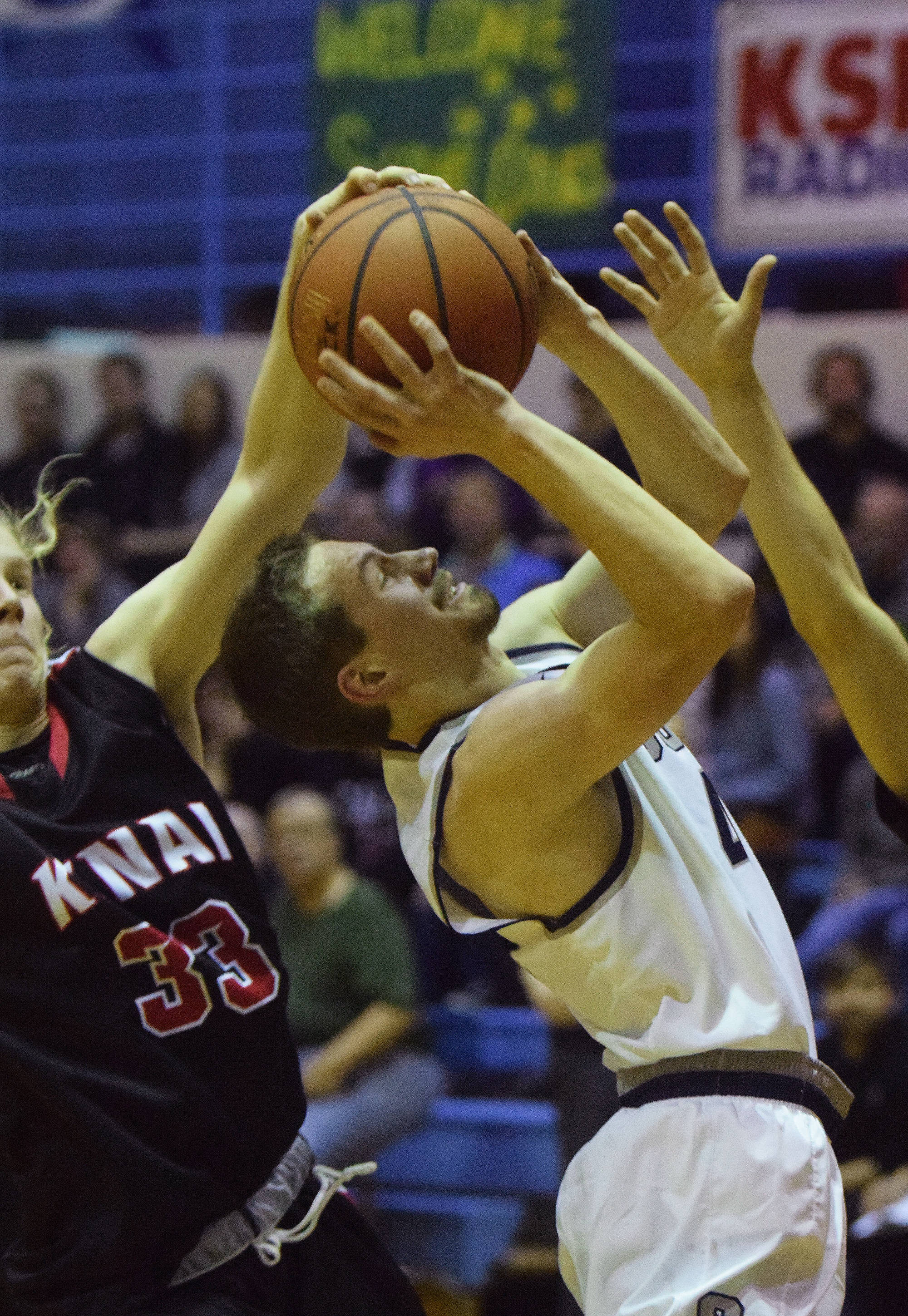 Soldotna’s Caleb Spence gets blocked by Kenai’s Preben Strende (left) Friday at the Powerade/Al Howard Tip-Off tournament at Soldotna High School. (Photo by Joey Klecka/Peninsula Clarion)