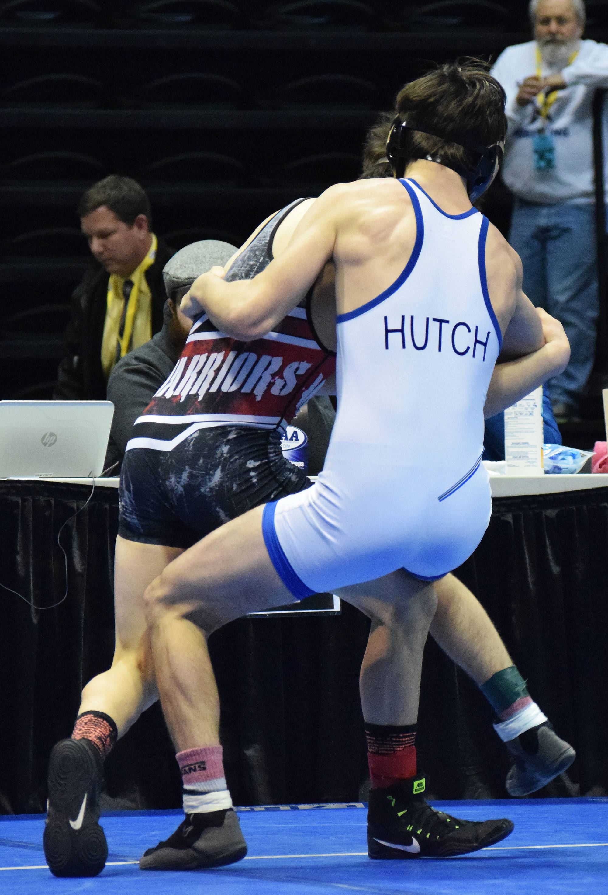 Soldotna junior Gideon Hutchison grapples with Wasilla’s Alex Logsdon in the 120-pound final Saturday night at the Division I state wrestling championships at the Alaska Airlines Center in Anchorage. (Photo by Joey Klecka/Peninsula Clarion)