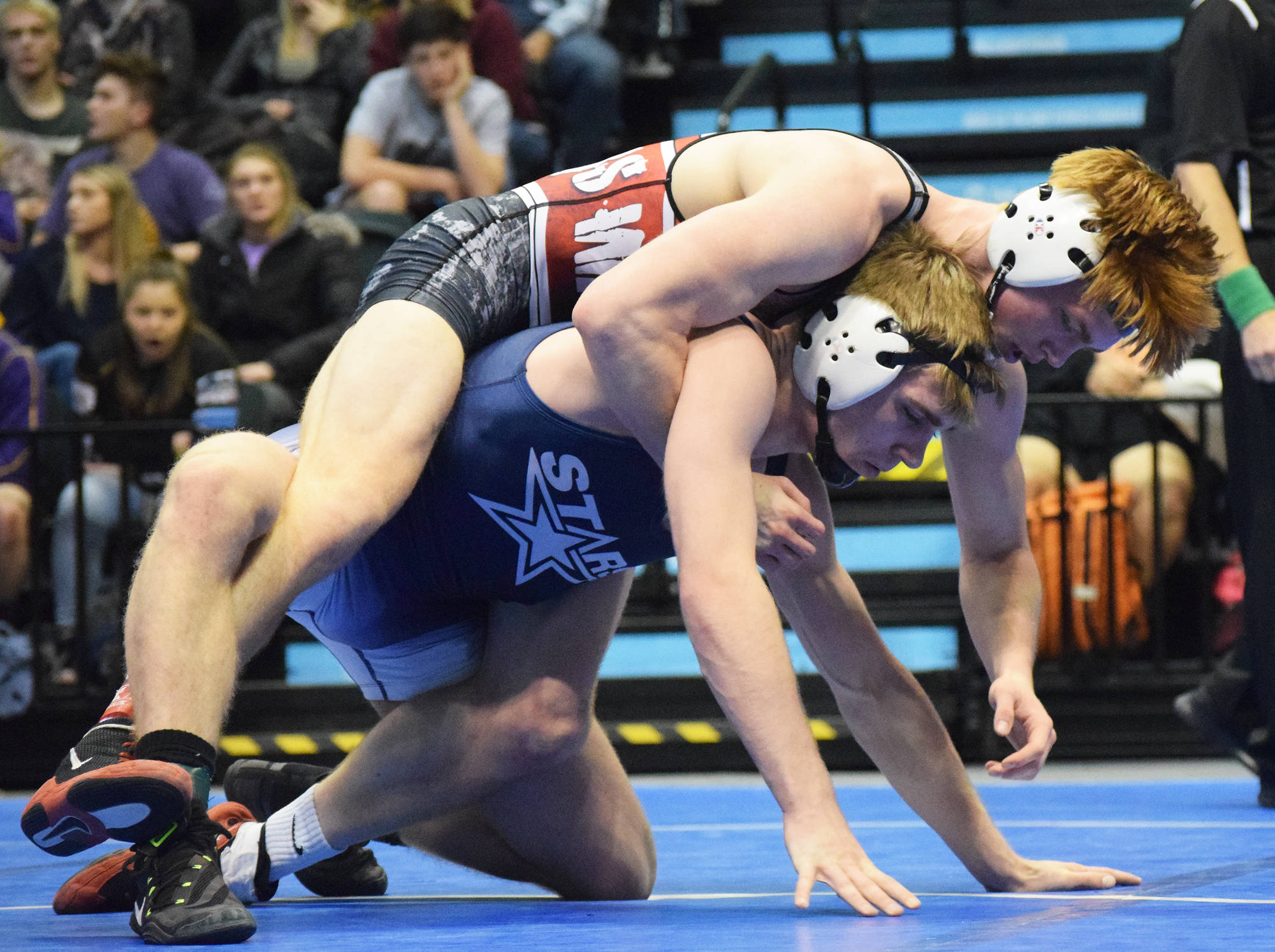 Soldotna’s Bechler Metcalf (bottom) fights against Wasilla’s Andrue Shepersky in the 152-pound final Saturday night at the Division I state wrestling championships at the Alaska Airlines Center in Anchorage. (Photo by Joey Klecka/Peninsula Clarion)