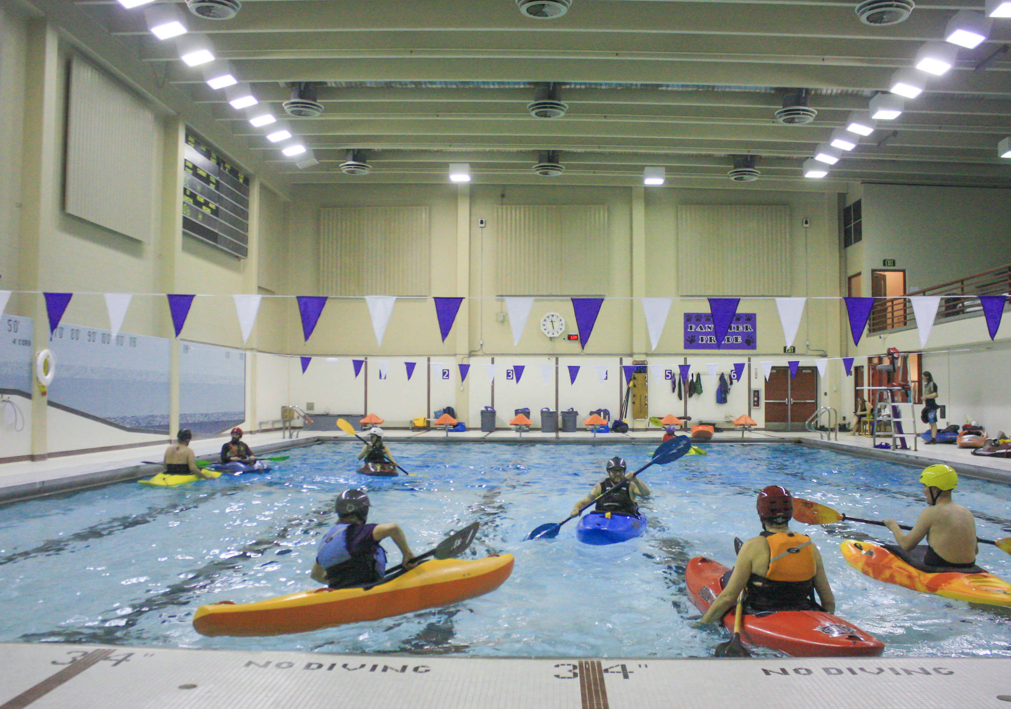 Kayakers practice at the Skyview pool during a Dec. 13. clinic. (Photo by Erin Thompson/Peninsula Clarion)