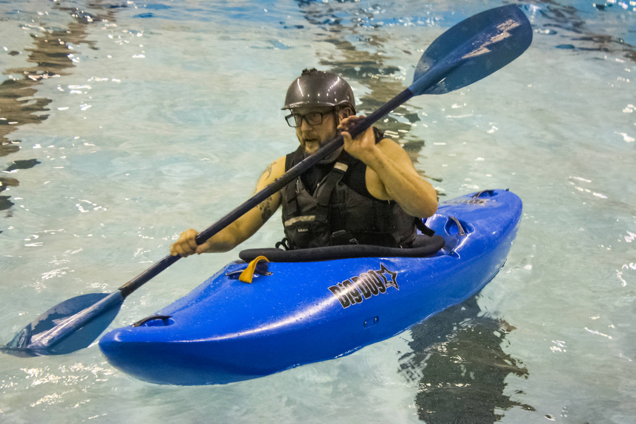 Matthew Pyhala, owner of the Immersion Paddling Academy, provides lessons during a Dec. 13 training session at the Skyview pool. (Photo by Erin Thompson/Peninsula Clarion)