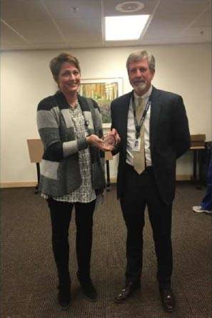 This photo taken from Central Peninsula Hospital’s presentation to the Kenai Peninsula Borough Assembly shows Central Peninsula Hospital CEO Rick Davis (right) accepting an award from a LifeCenter Northwest representative acknowleding the hospital’s work in January 2016 to recoer and transport the organs from a young man who died unexpectedly. (Photo courtesy Central Peninsula Hospital)