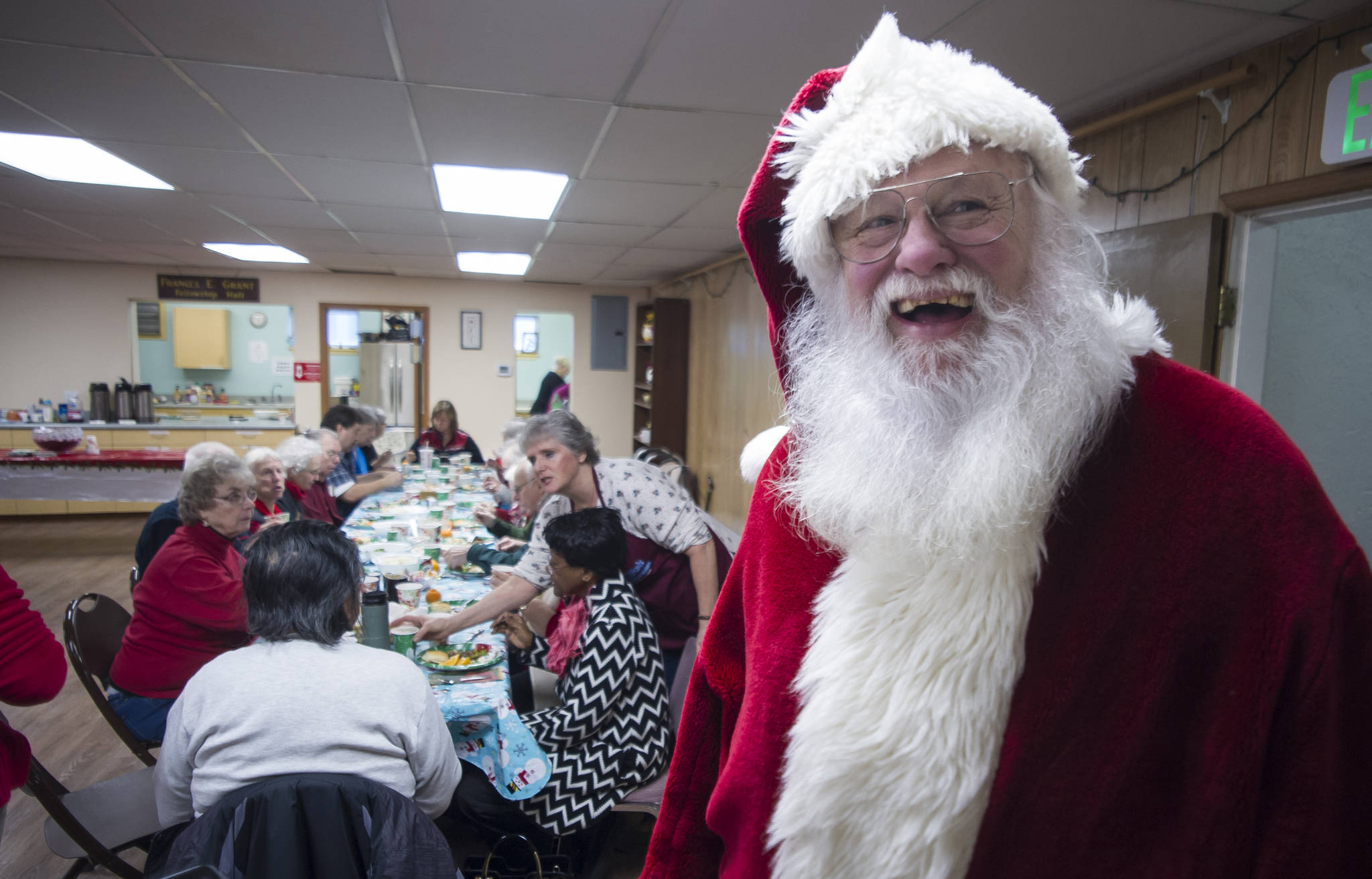 Jack Marshall visits the senior lunch at the Douglas United Methodist Church on Thursday, Dec. 21, 2017. (Michael Penn | Juneau Empire)