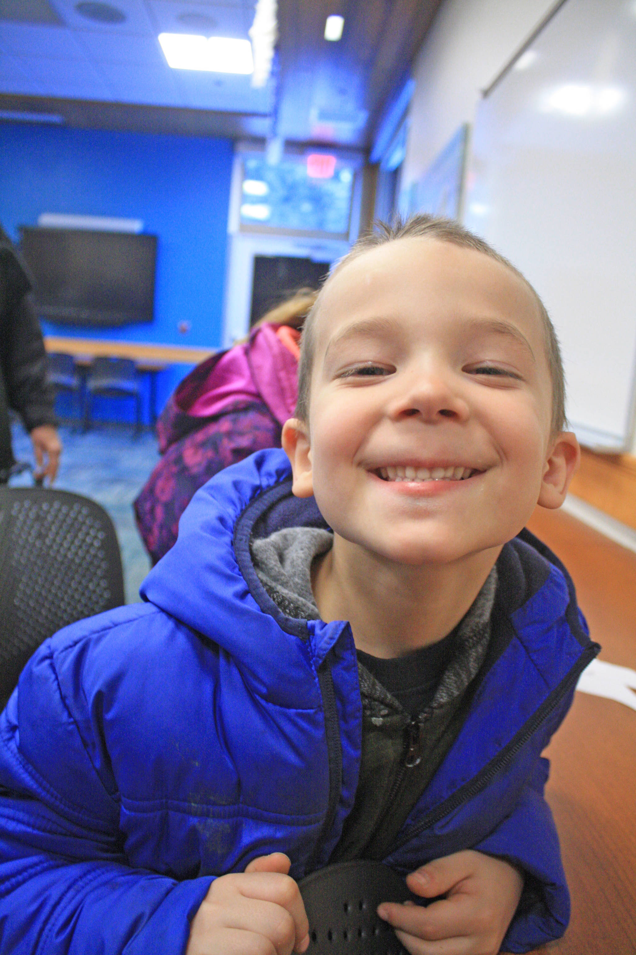 Phillip Larson, 6, takes a break from crafts at the Kenai National Wildlife Refuge Visitor Center on Dec. 27. The visitor center hosted an afternoon of family-friendly activities. (Photo by Erin Thompson/Peninsula Clarion)