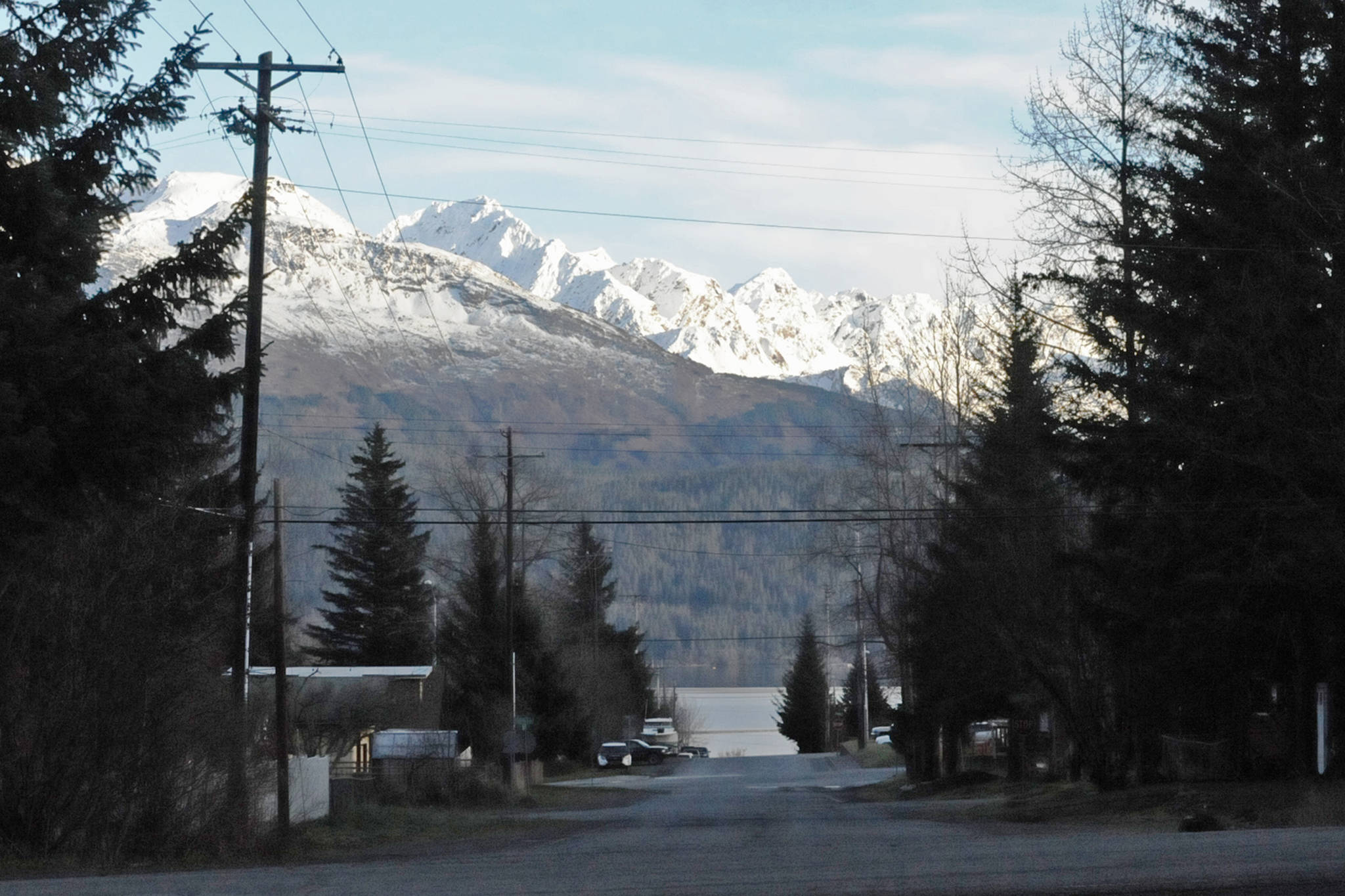 In this November 2016 photo, the Chugach Mountains loom high above Monroe Street in Seward, Alaska. (Photo by Elizabeth Earl/Peninsula Clarion, file)