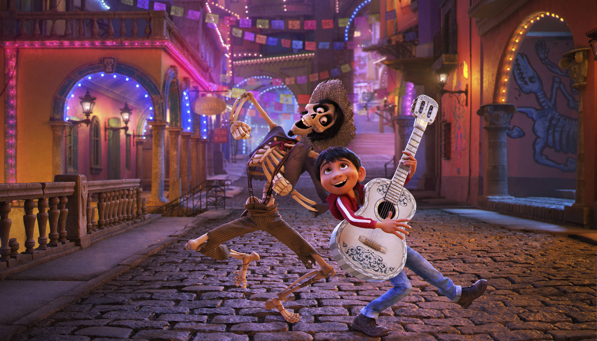 In this image released by Disney-Pixar, character Hector, voiced by Gael Garcia Bernal, left, and Miguel, voiced by Anthony Gonzalez, appear in a scene from the animated film, “Coco.” (Disney-Pixar via AP)