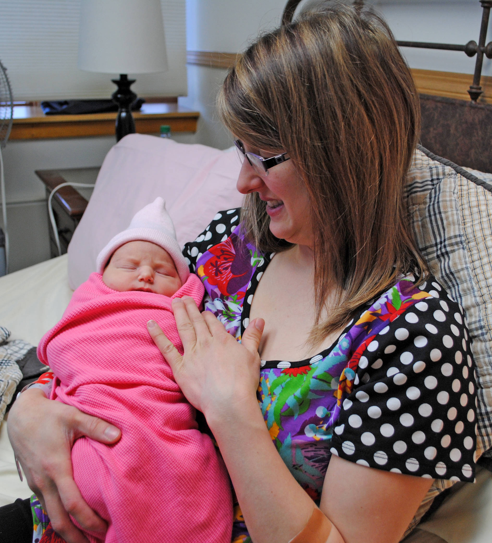 Chelsea Samora of Kenai holds her newborn daughter, Zoe, whose Jan. 3 birthday makes her the first baby born in Central Peninsula Hospital in 2018. (Photo by Kat Sorensen/Peninsula Clarion)