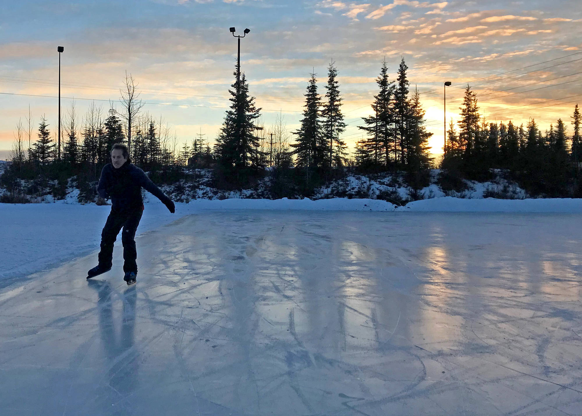 Fernando Ramos of Soldotna skates along the ice at Daubenspeck Family Park just off Marathon Road, behind Walmart, on Sunday, Jan. 7. A figure-eight course has been maintained on the pond for skating. Ramos moved to Soldotna from Mexico in November to be with his wife, who has lived in the area for 23 years. He said his favorite aspects of the central Kenai Peninsula, so far, are cross-country skiing and skating. (Photo by Kat Sorensen/Peninsula Clarion)