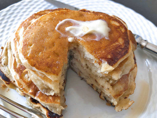 This undated photo shows ripe banana pancakes. The bananas are mashed as if making banana bread and added to the batter right before the pancakes are prepared. The result is almost like banana bread pancakes. (AP Photo/Elizabeth Karmel)