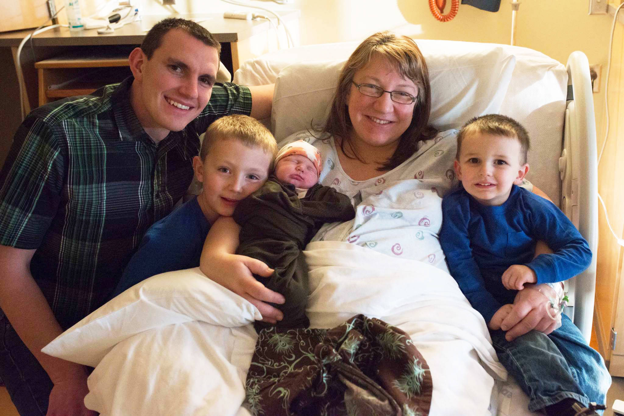 The Buzga family, from left to right: David, 5-year-old Blake, newborn Brooke, Jaimee, and 2-year-old Bradley, celebrate the addition to their family at South Peninsula Hospital. Brooke was the first baby born at the Hospital in the New Year, on Jan 4, 2018. (Photo by Katie Cannon)