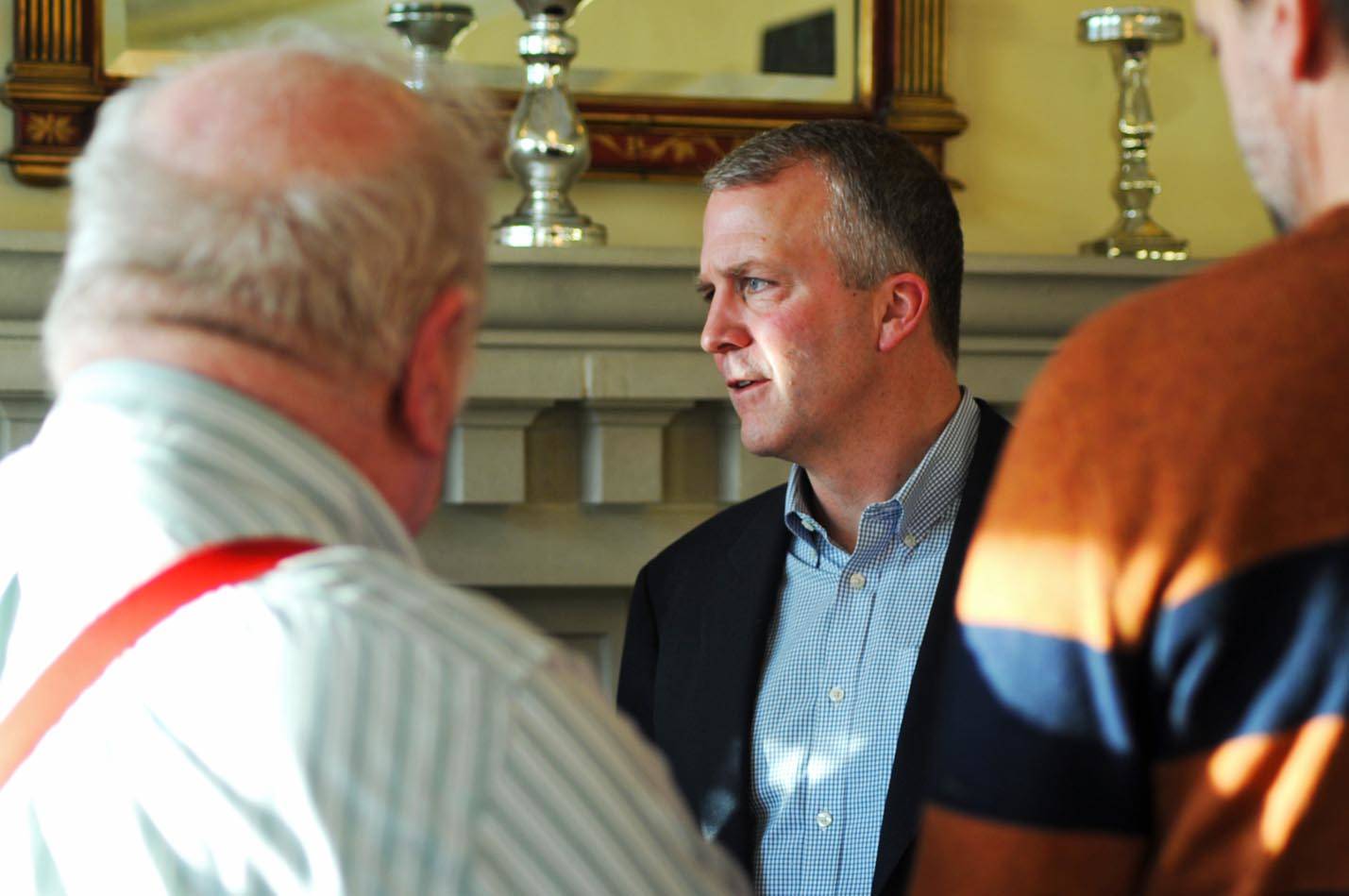 Sen. Dan Sullivan (R-Alaska) speaks to constituents after addressing the members of three Kenai- and Soldotna-area Rotary Clubs at Froso’s Restaurant on Monday in Soldotna. Sullivan, entering his third year as U.S. Senator for the state, said he found reasons to be optimistic about federal actions regarding the state in 2018. (Photo by Elizabeth Earl/Peninsula Clarion)