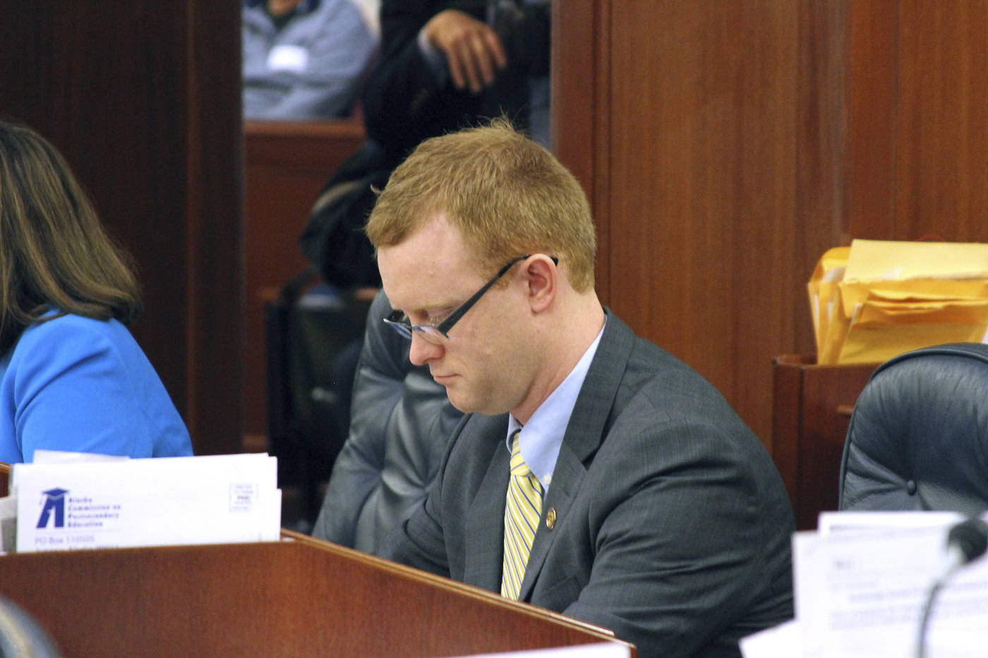 In this Tuesday photo, Rep. David Eastman, a Wasilla Republican, sits at a desk on the floor of the Alaska House of Representatives in Juneau. A special panel on Thursday recommended the removal of Eastman from the legislative ethics committee for allegedly disclosing to a member of the public the existence of a complaint that was considered confidential. (AP Photo/Mark Thiessen)