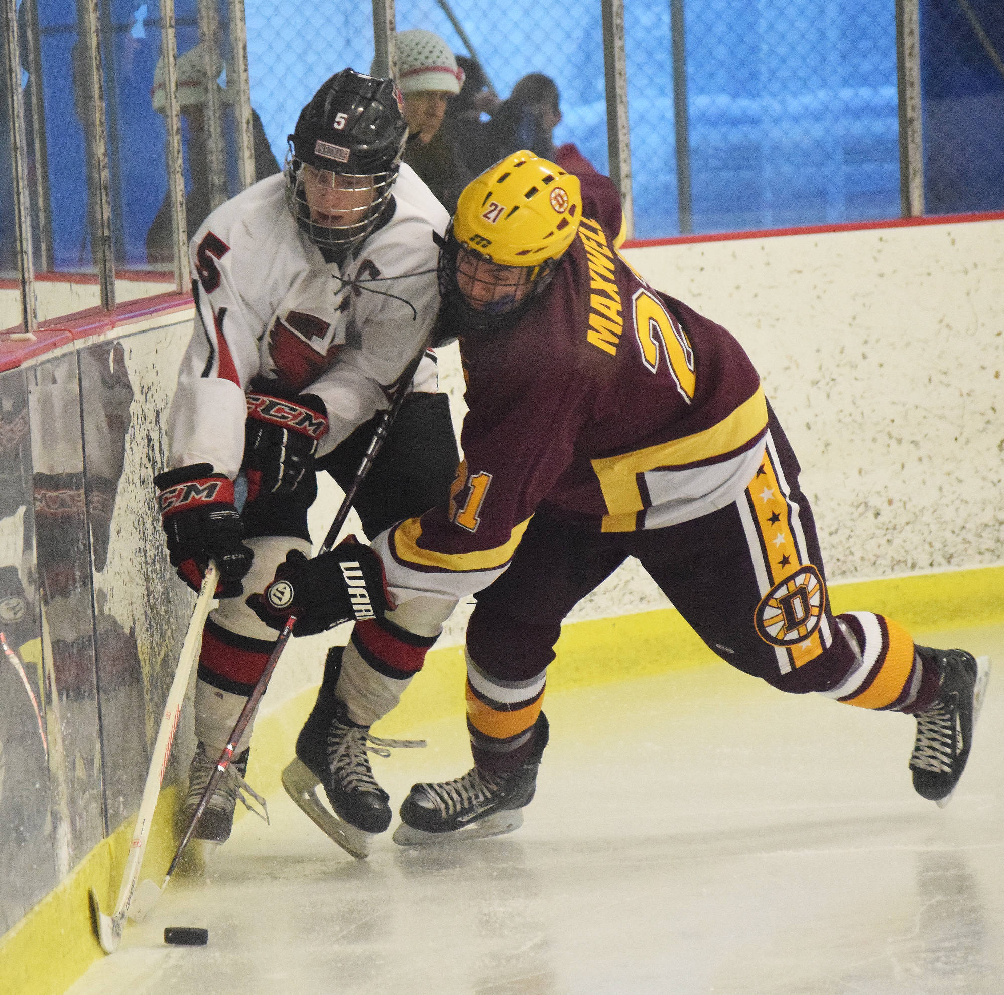 Kenai skater Levi Mese battles for the puck against Dimond’s Justin Maxwell (right) Saturday afternoon at the Kenai Multipurpose Facility. (Photo by Joey Klecka/Peninsula Clarion)