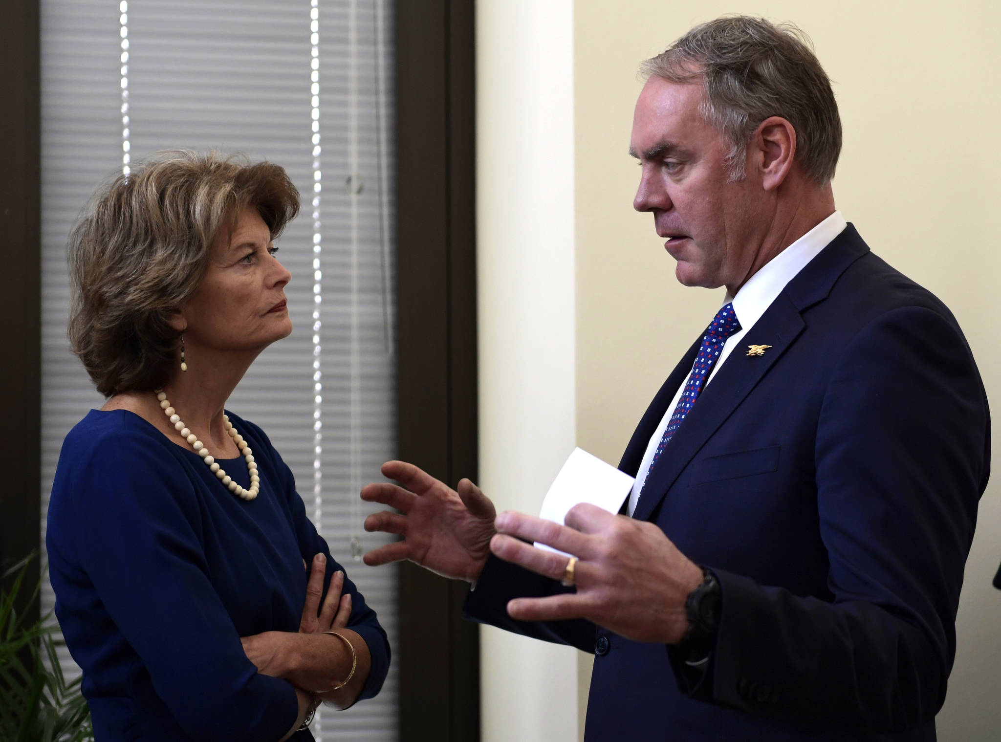 Sen. Lisa Murkowski, R-Alaska, left, talks with Interior Secretary Ryan Zinke, right, before an event in her office on Capitol Hill in Washington, Monday. (AP Photo/Susan Walsh)