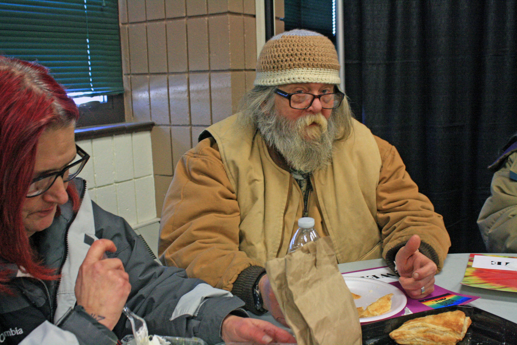 Donald Akers sits down to lunch during Project Homeless Connect at the Soldotna Regional Sports Complex on Jan. 24. Akers, who was referred to the event by counselors at the Peninsula Community Health Services, came to the event to get extra winter clothes and some propane. (Photo by Erin Thompson/Peninsula Clarion)