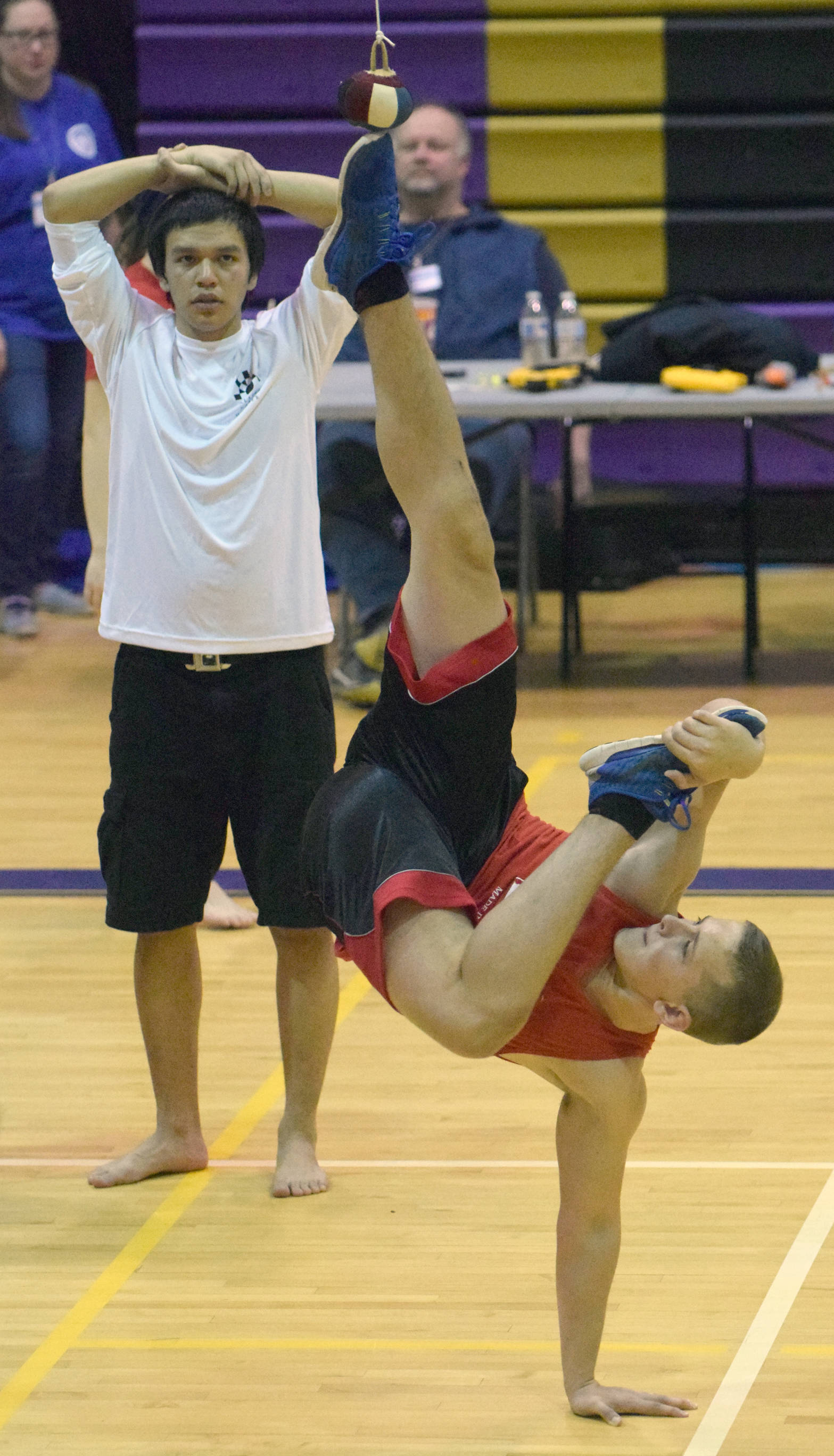 Judah Eason, of Ninilchik, wins the Senior Boys Alaskan High Kick on Friday, Jan. 26, 2018, at Kenai Middle School at the 2018 Peninsula Winter Games Kenaizte Indian Tribe NYO Invitational. (Photo by Jeff Helminiak/Peninsula Clarion)