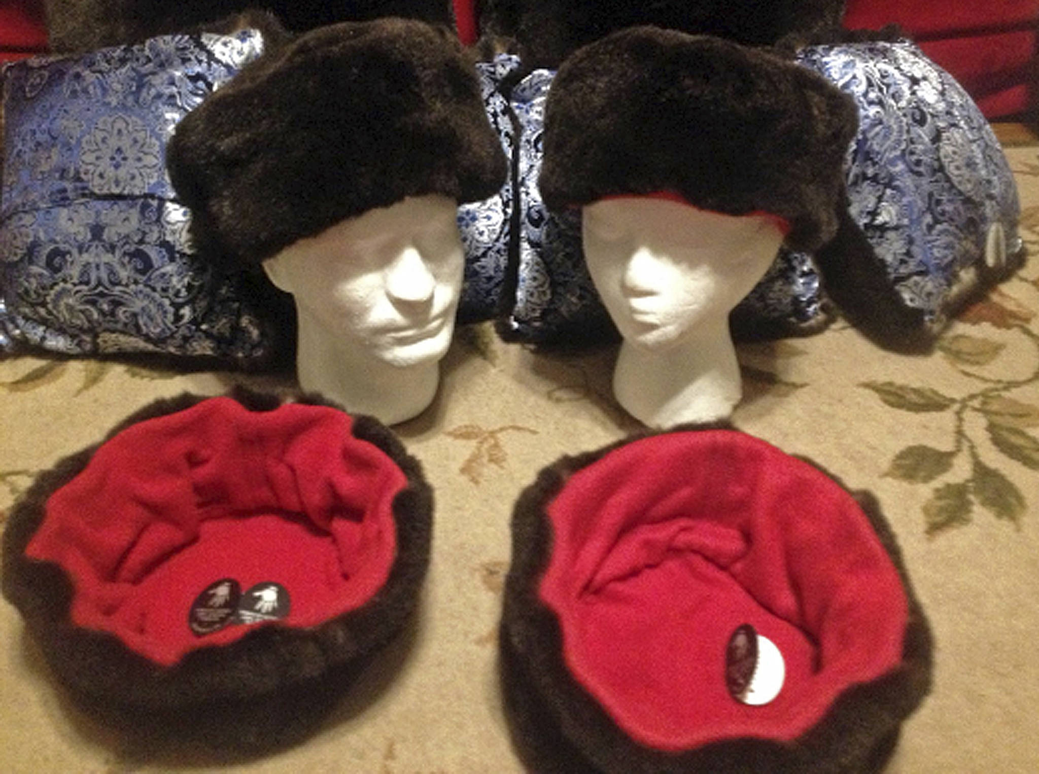 This undated file photo shows hats trimmed with sea otter fur, offered by Alaska Native Marcus Gho’s Tuvraqtuq online retail store based in Juneau. (Marcus Gho via AP, file)