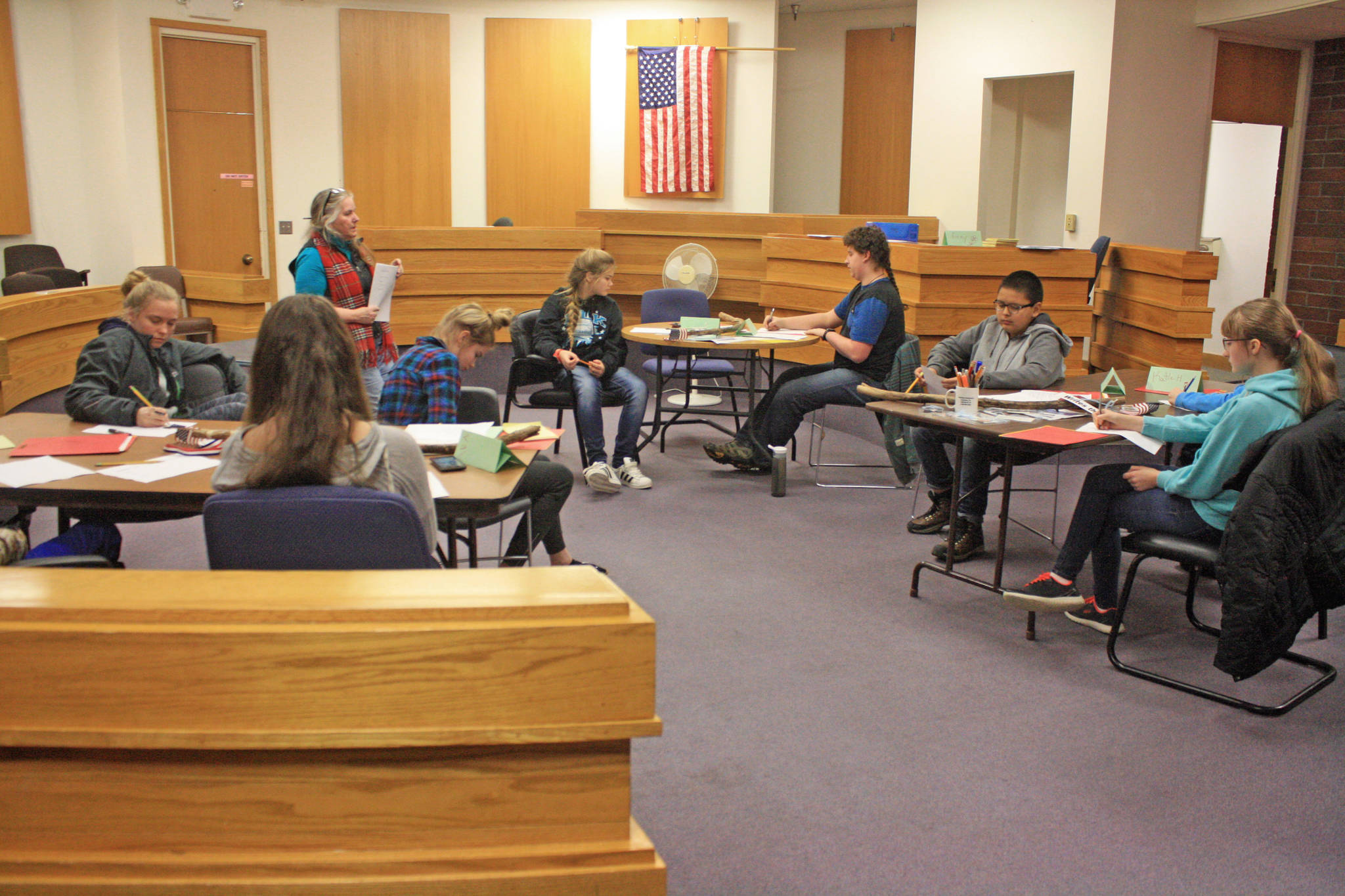 Students listen to Kenai Peninsula Youth Court Director Ginny Espenshade during a training session at the Old Kenai Courthouse on Jan. 30. The students are participating in a weeks-long program to prepare them for roles on the court. (Photo by Erin Thompson/Peninsula Clarion)