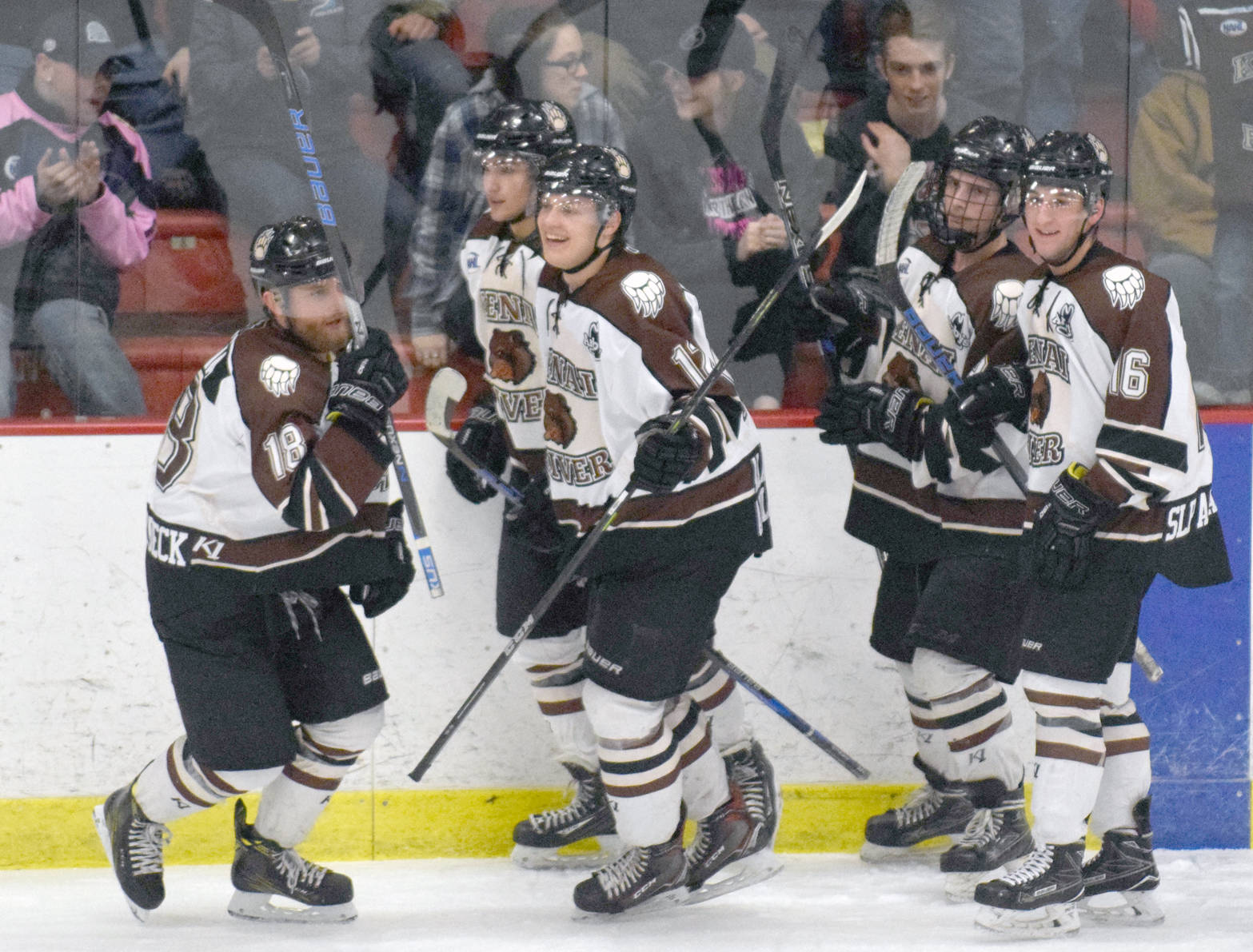 Brown Bears forward Gil Garcia (far left) celebrates his power-play goal in the first period Friday, Feb. 16, 2018, at the Soldotna Regional Sports Complex. (Photo by Jeff Helminiak/Peninsula Clarion)