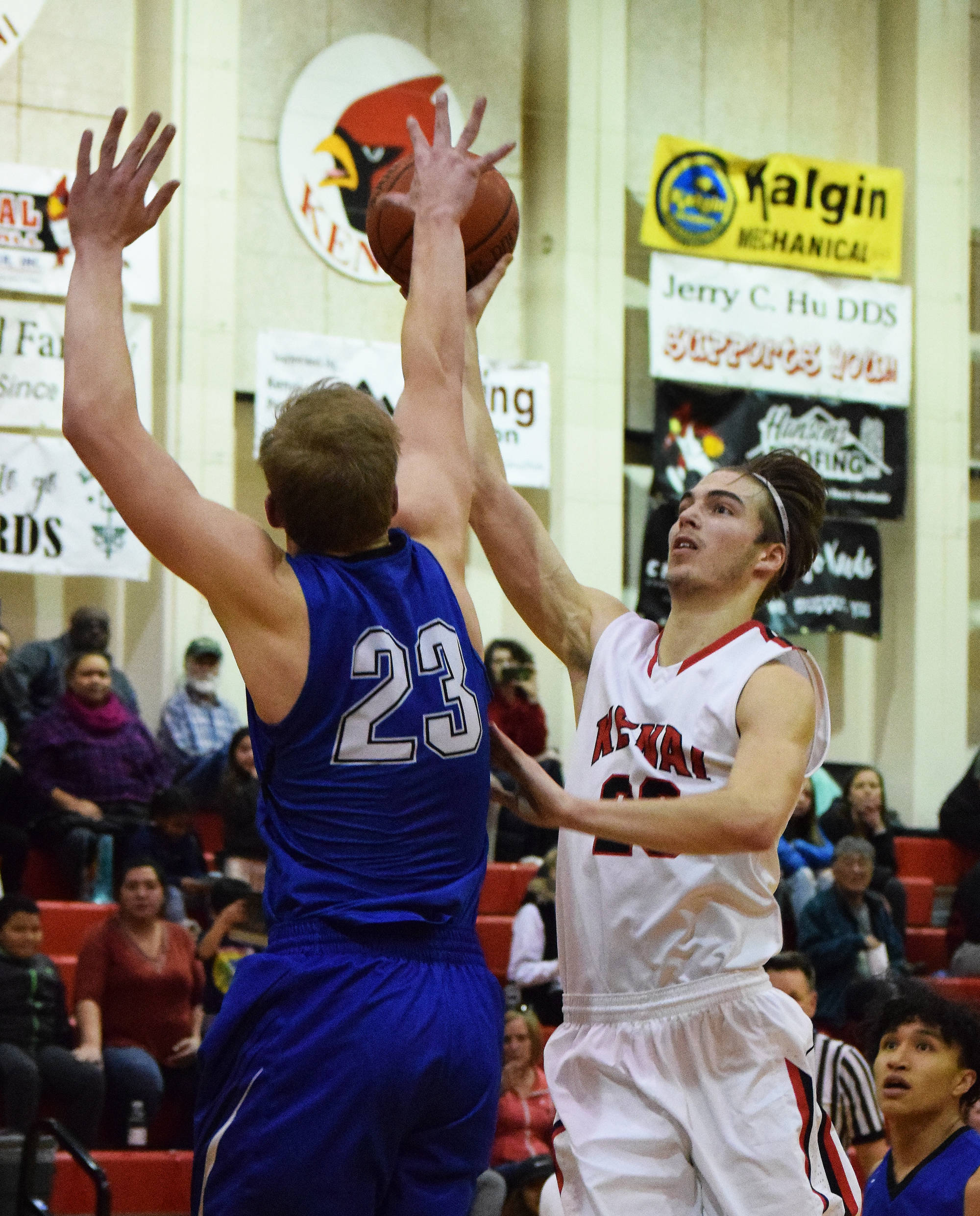 Kenai senior Luke Beiser puts up a shot in front of Palmer’s Clayton Southwick (23) Friday night at Kenai Central High School. (Photo by Joey Klecka/Peninsula Clarion)