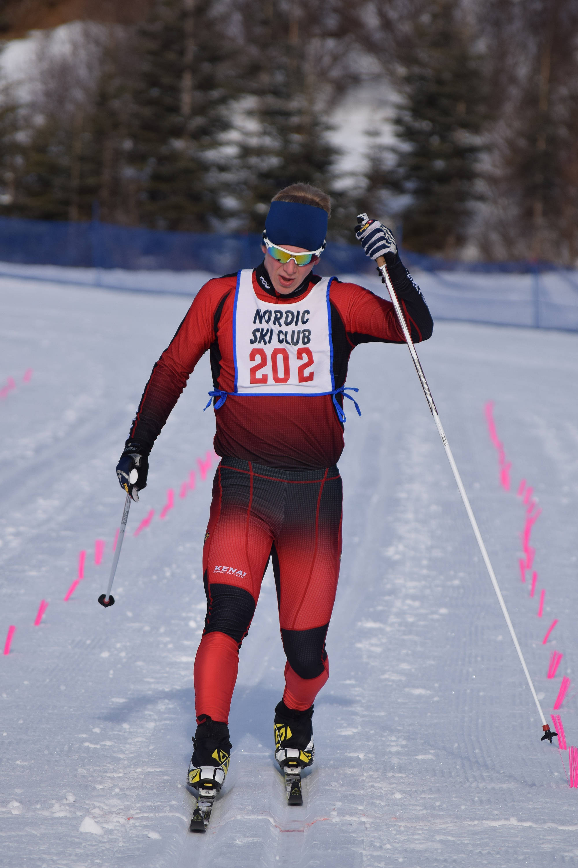 Kenai Central senior Karl Danielson toes the finish line to win the boys varsity race Saturday afternoon at the Region III skiing championships at the Tsalteshi Trails in Soldotna. (Photo by Joey Klecka/Peninsula Clarion)