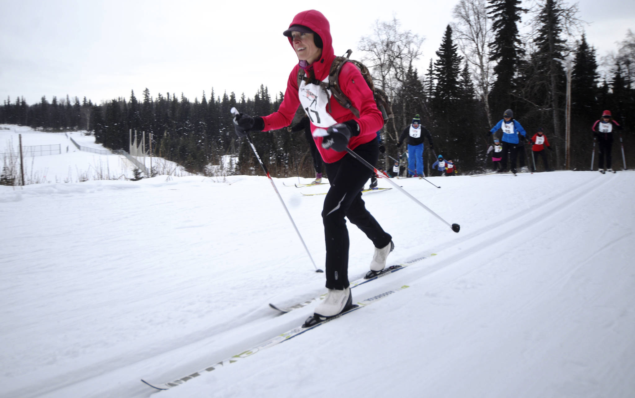Classic skier Laura Griffin reaches the top of the first hill in the 20-kilometer Tour of Tsalteshi ski race on Sunday, Feb. 18, 2018 near Soldotna, Alaska.