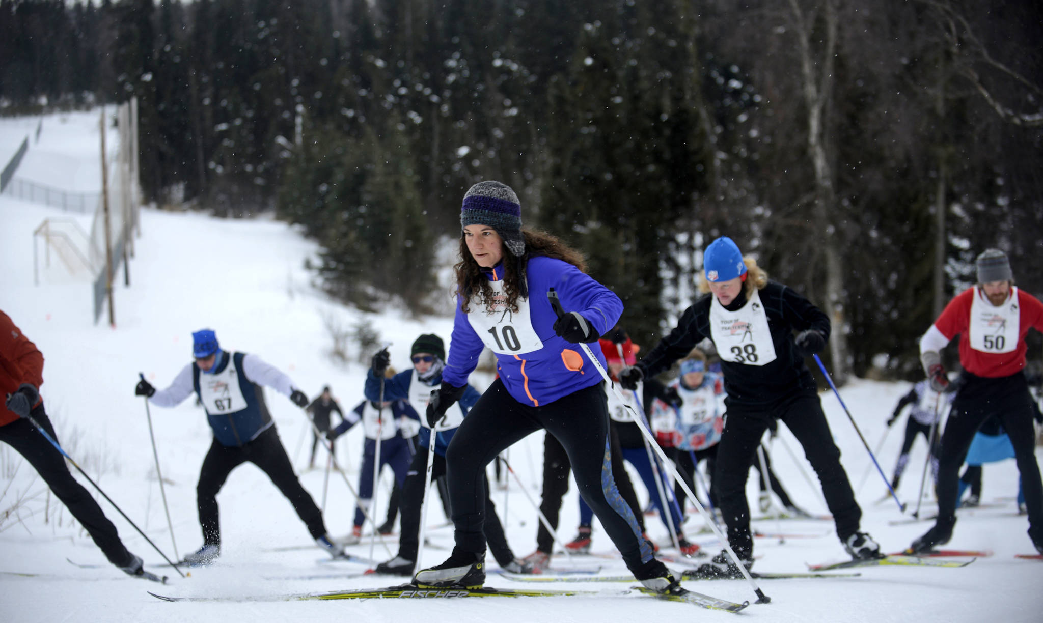 Skiers in the 20-kilometer Tour of Tsalteshi ski race reach the top of their first hill on Sunday, Feb. 18, 2018, in Soldotna, Alaska. This year was the first for the Tour of Tsalteshi, in which 60 entrants raced the entire 20 kilometers of the volunteer-maintained Tsalteshi Trails ski course, while 11 raced two laps for a total of 40 kilometers.