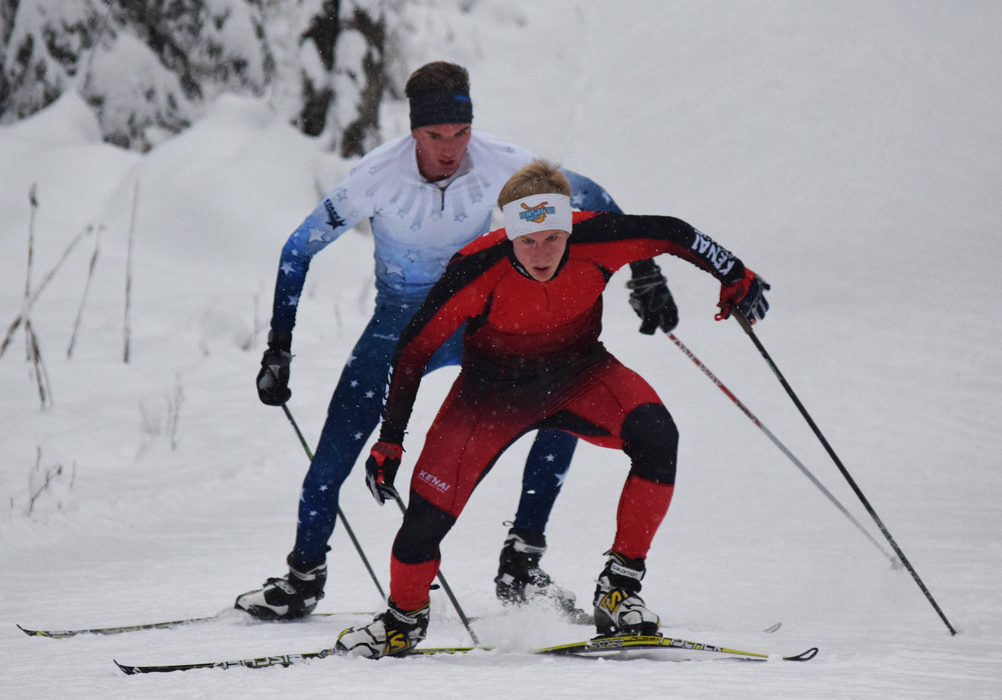 Kenai Central’s Karl Danielson leads Soldotna’s John-Mark Pothast up Kill Bill hill Nov. 21, 2017, at the Turkey Skate race on the Tsalteshi Trails in Soldotna. (Photo by Joey Klecka/Peninsula Clarion)