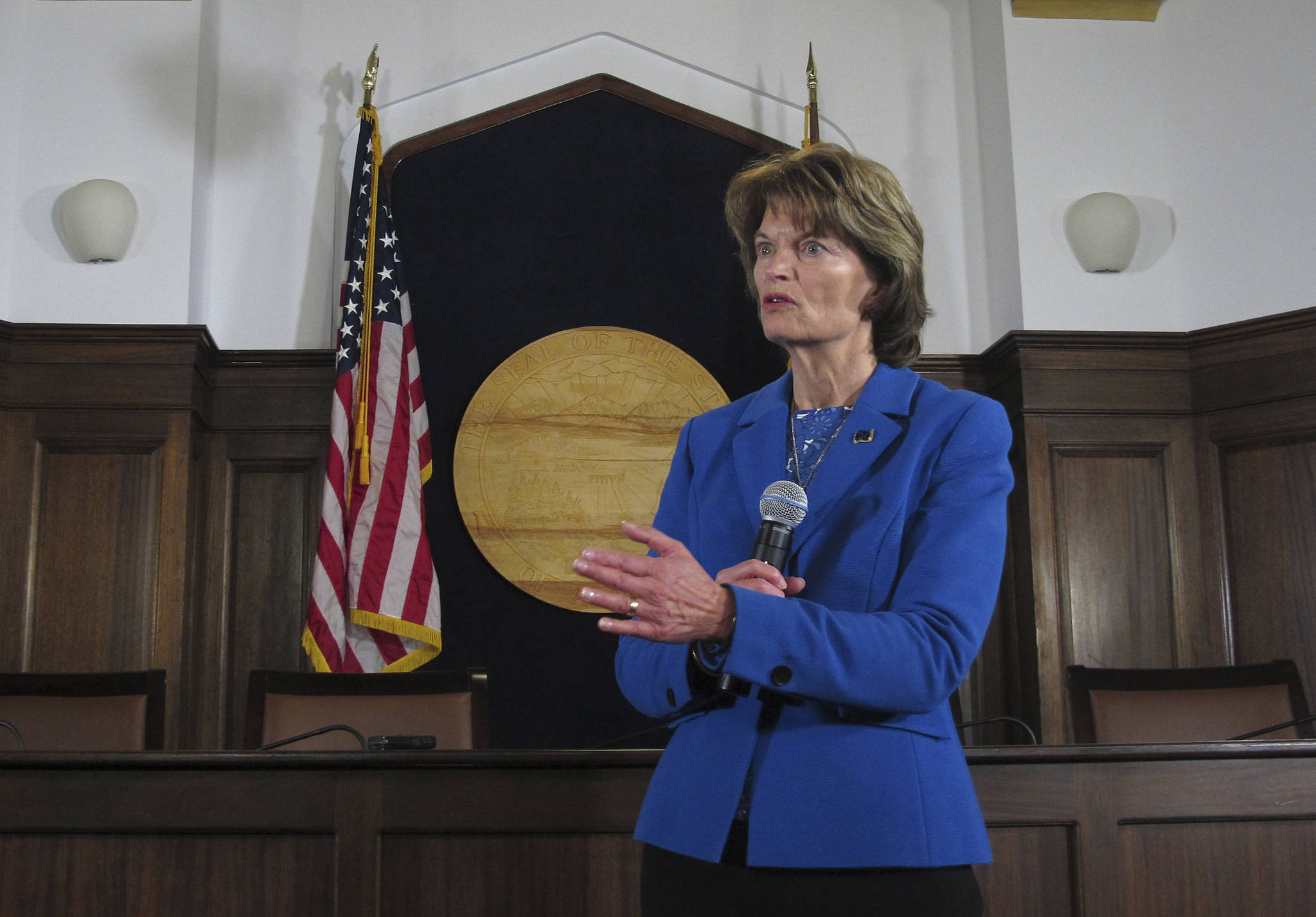 U.S. Sen. Lisa Murkowski speaks to reporters after addressing a joint session of the Alaska Legislature on Thursday in Juneau. (AP Photo/Becky Bohrer)