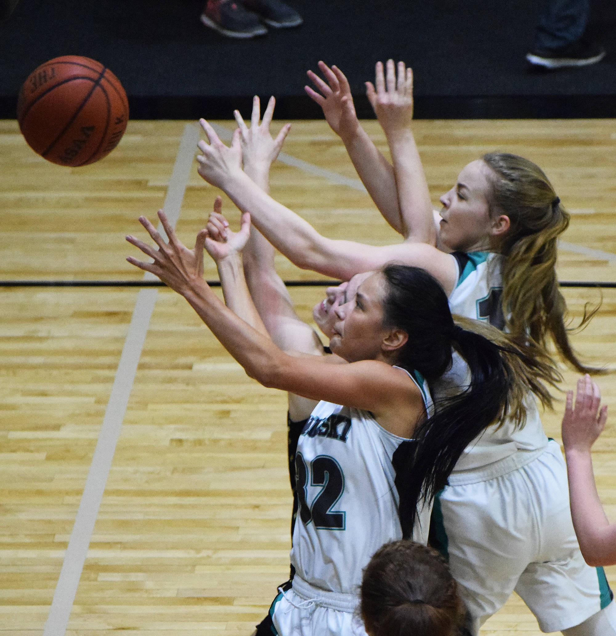 Rylee Jackson of Nikiski contends for a rebound Thursday night against Grace Christian at Nikiski High School. (Photo by Joey Klecka/Peninsula Clarion)