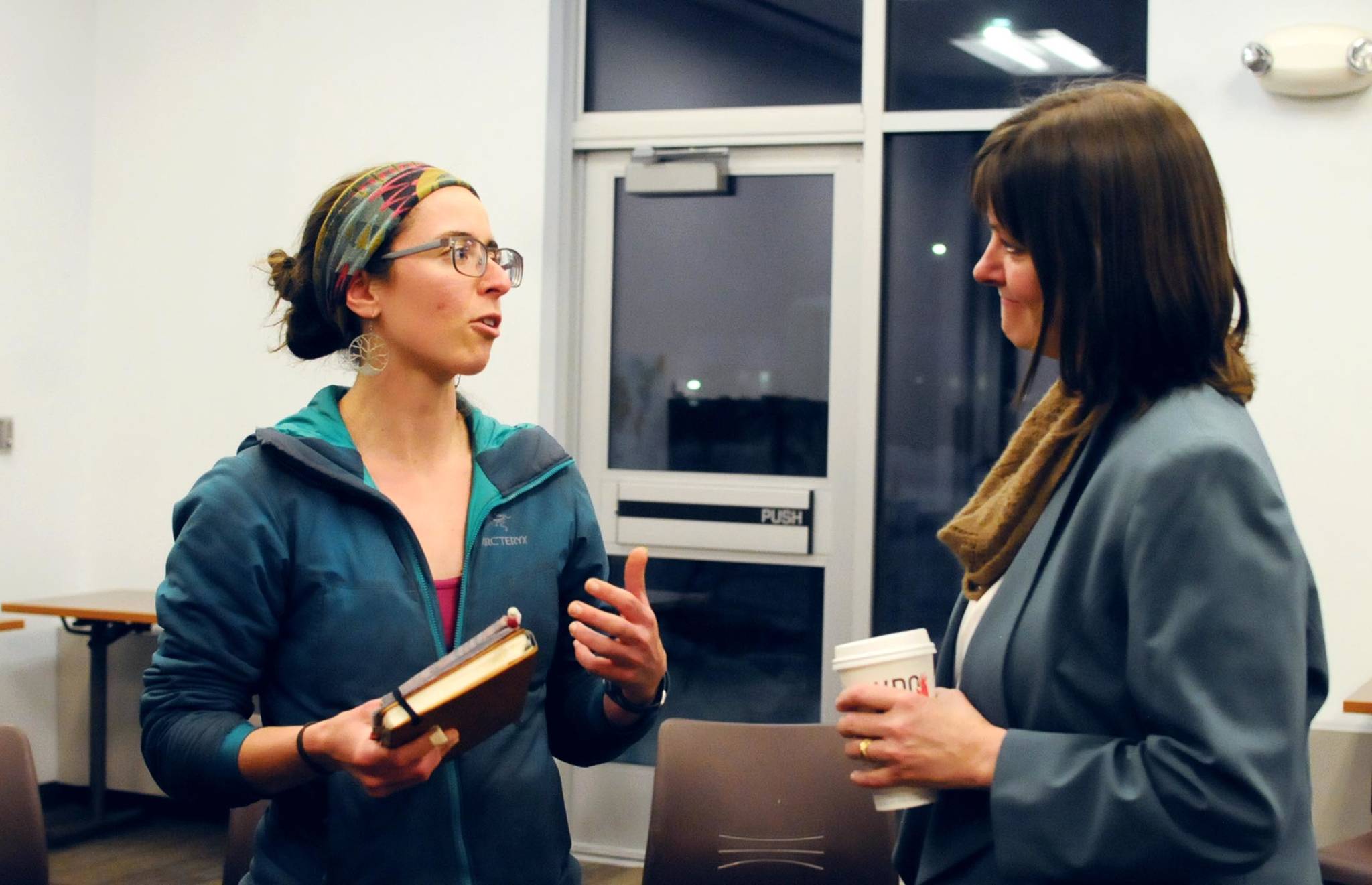 Alyse Galvin (right), a candidate for Alaska’s sole U.S. House of Representatives seat, speaks with Soldotna-area resident Bonnie Bernard during a meet-and-greet hosted by community coalition Many Voices at the Soldotna Public Library on Thursday, Feb. 22, 2018 in Soldotna, Alaska. Galvin is one of two candidates challenging incumbent Rep. Don Young (R-Alaska) for the seat. (Photo by Elizabeth Earl/Peninsula Clarion)