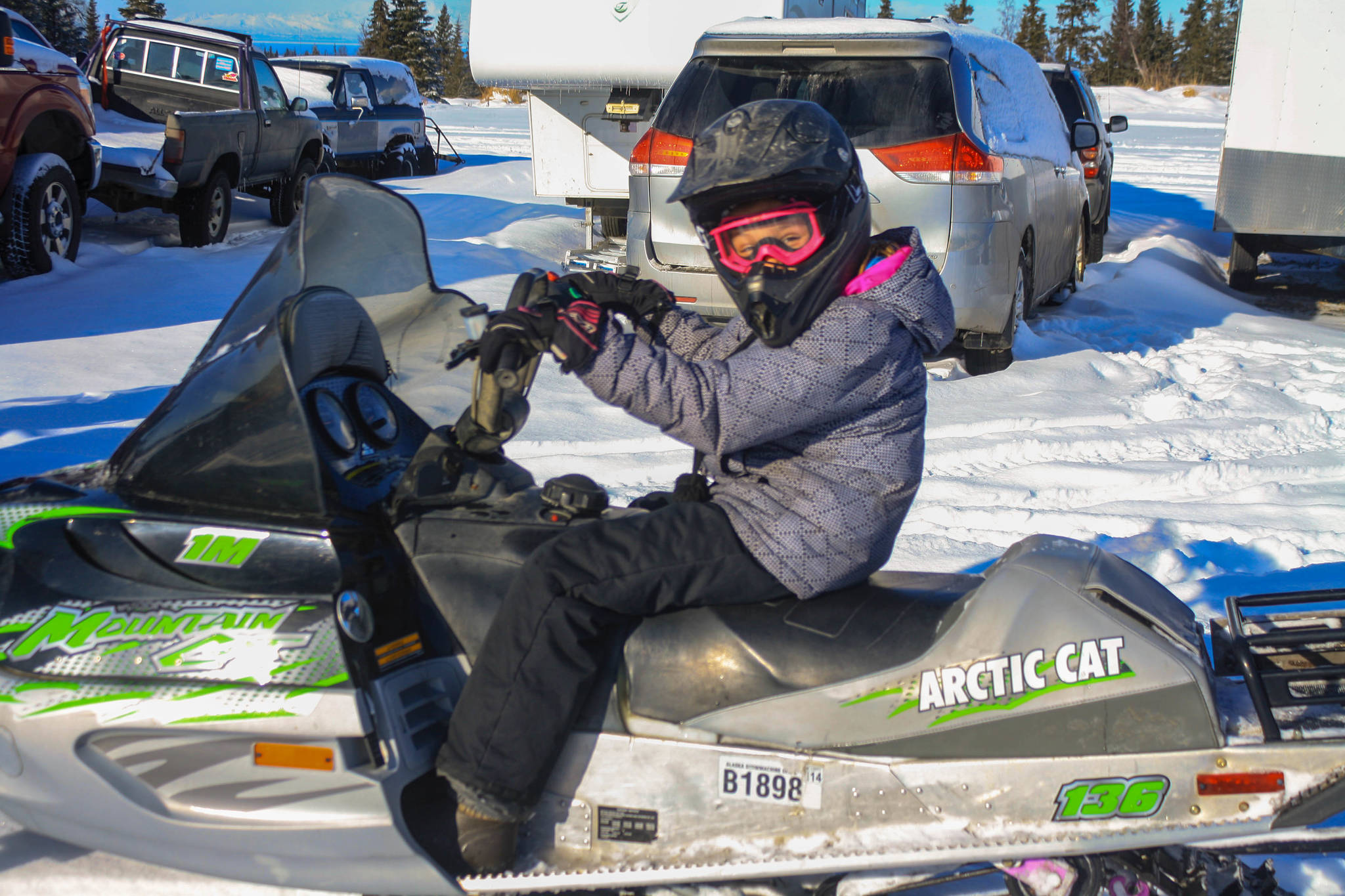 A young rider returns from a 50-mile loop of the Caribou Hills as part of the Way Out Women Ride, which raises money for cancer patients, on Saturday, Feb. 24, 2018 near Ninilchik, Alaska. (Photo by Erin Thompson/Peninsula Clarion)