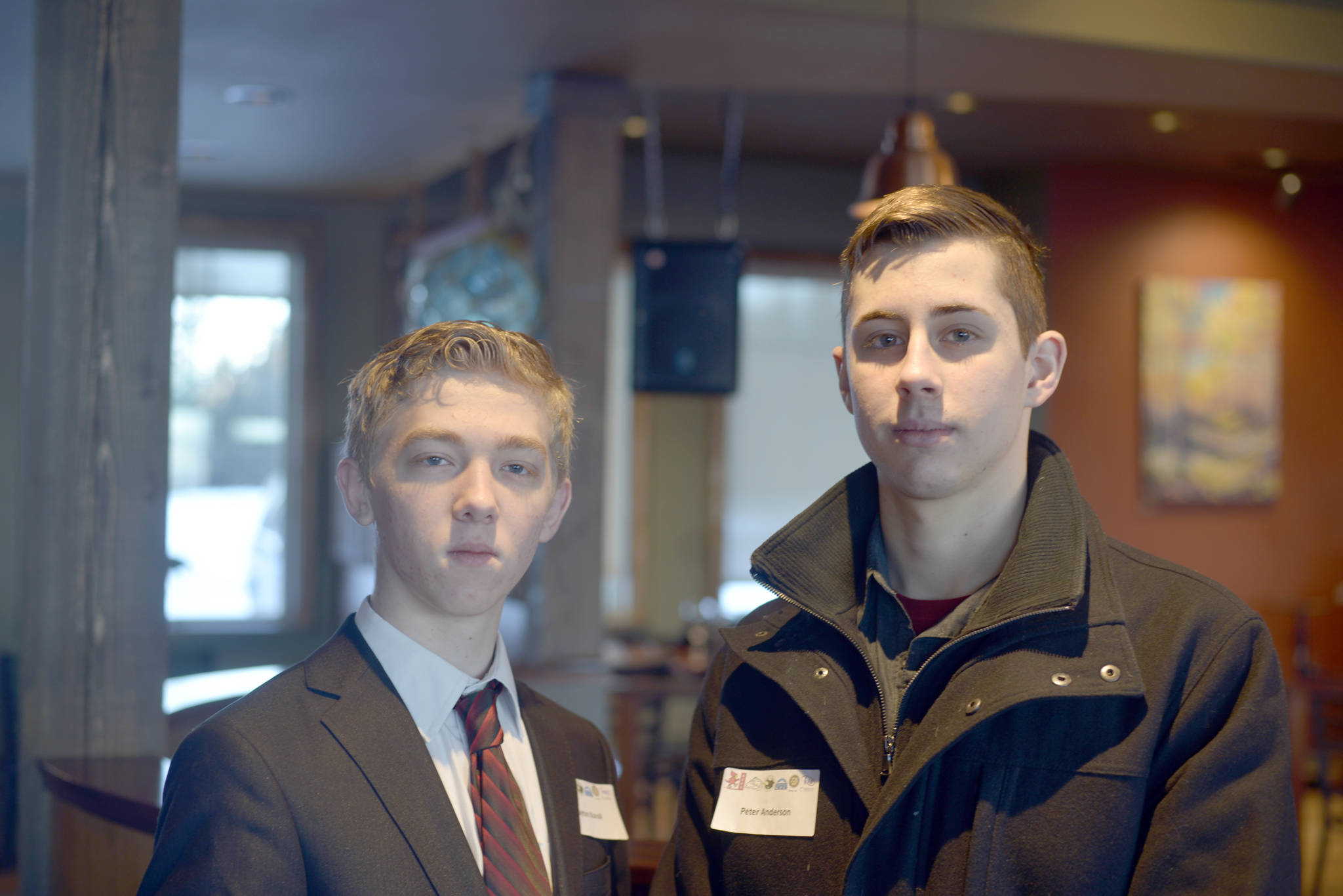 Clayton Koroll, left, and Peter Anderson, juniors at Kenai Central High School, shadow Luke Thibodeau, owner of The Flats Bistro in Kenai, on Wednesday as part of the job shadow program through the Kenai Chamber of Commerce and the Alaska Job Center in Kenai. Koroll and Anderson both want to open small restaraunts and be their own bosses, just like Thibodeau. (Photo by Delbrian Parfitt/For the Clarion)