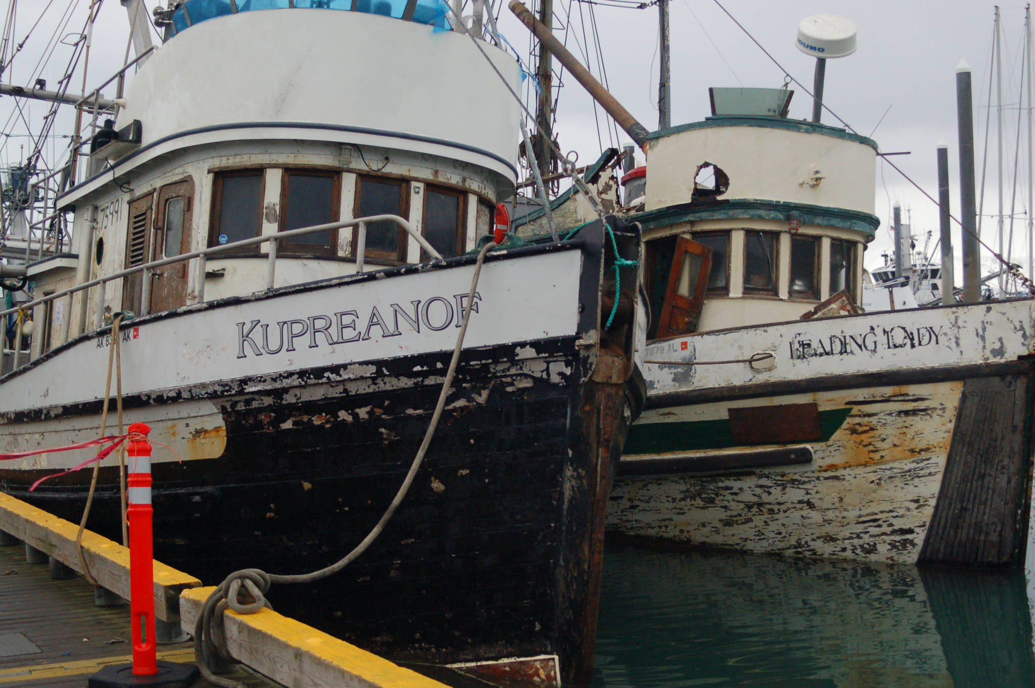 The F/V Kupreanof and F/V Leading Lady are moored at the Homer Harbor in 2013. The smell of rotting fish came from the boats and a light oil sheen surrounded them. (Michael Armstrong/Homer News, file)