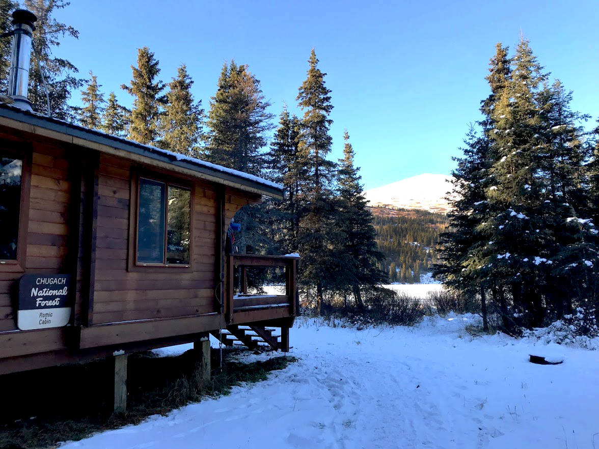 Romig Cabin, a public-use cabin on Juneau Lake, is seen here in Nov. 2017. The cabin can be rented online at recreation.gov and can be accesed by hiking, biking, skiing, horseback or snowmachine. (Photo by Kat Sorensen/Peninsula Clarion)